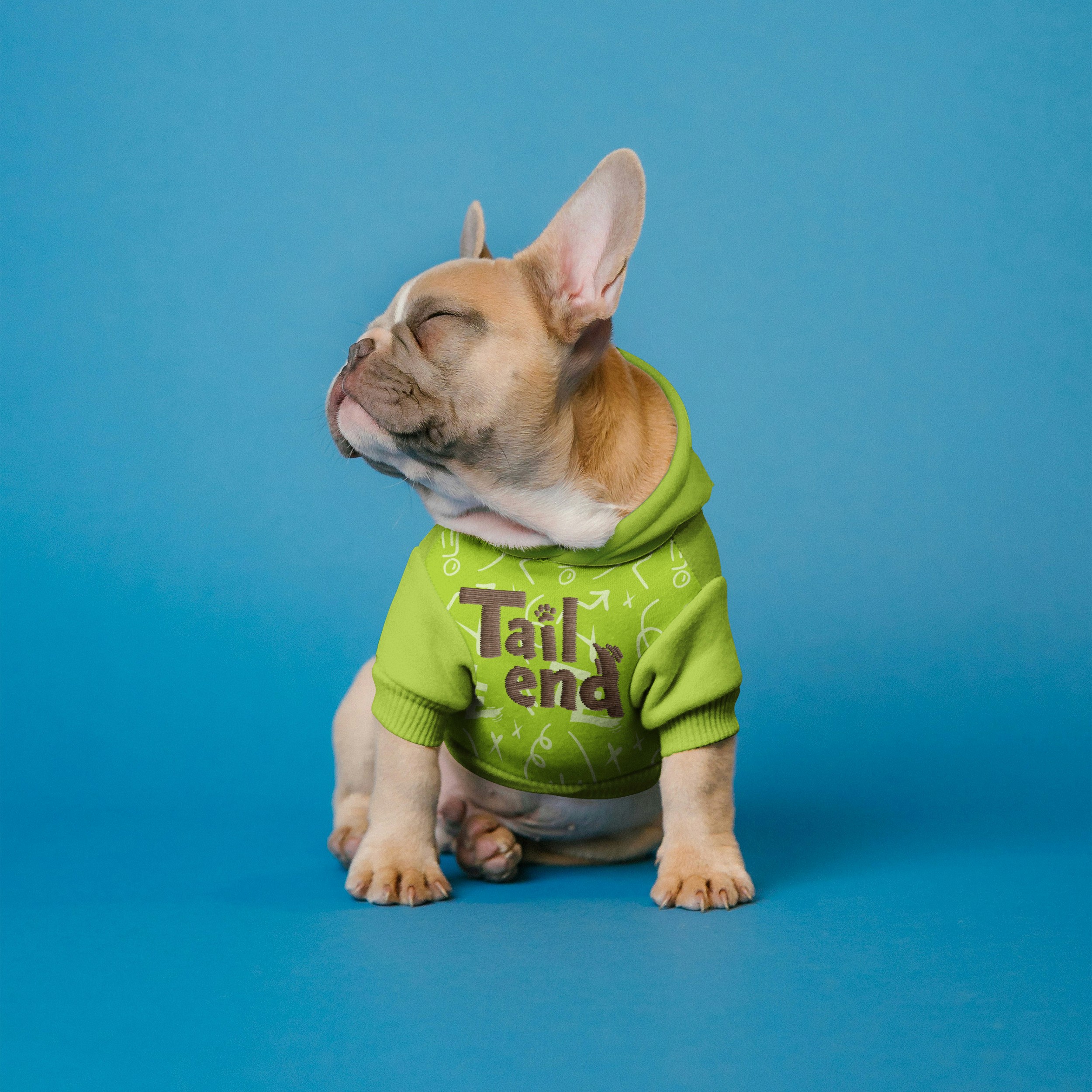 White branded cap with turquoise logo placed on fresh lemons in a red bowl