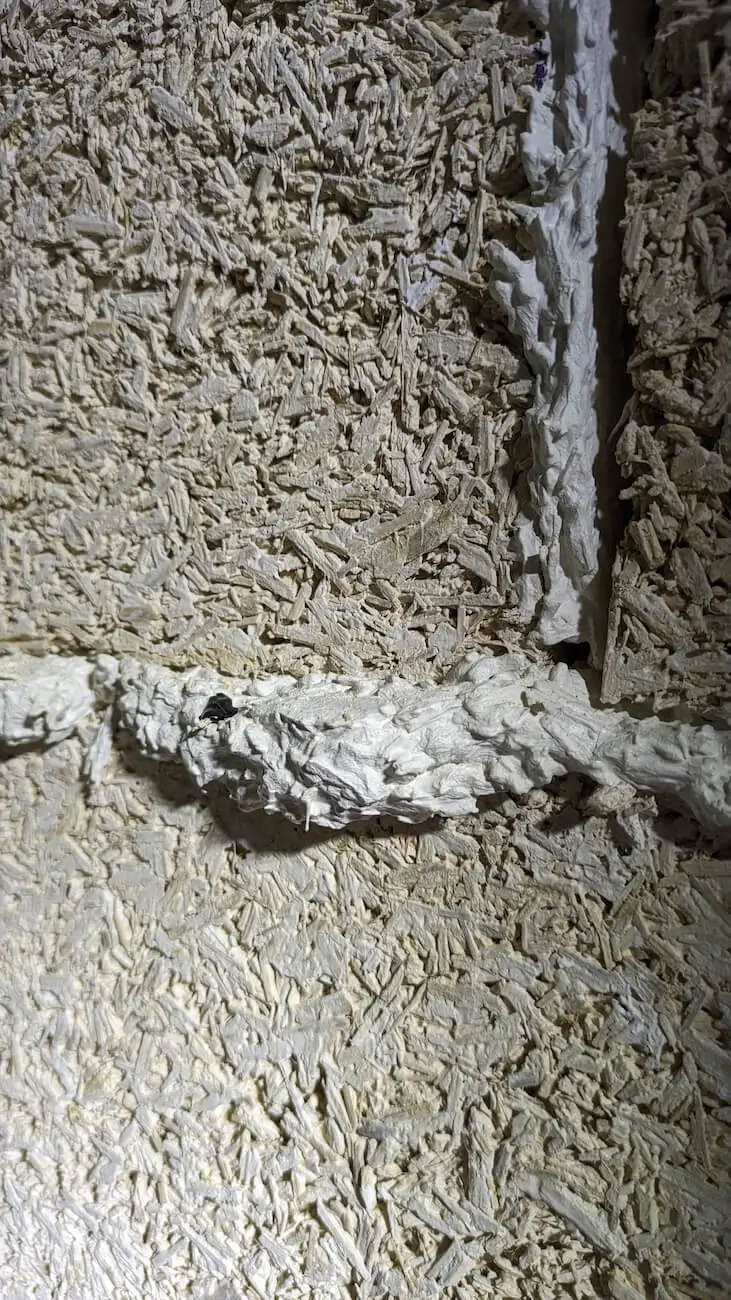 a beautiful hemp block wall showing the joints between the blocks filled with lime and hemp mortar for a natural, sustainable wall