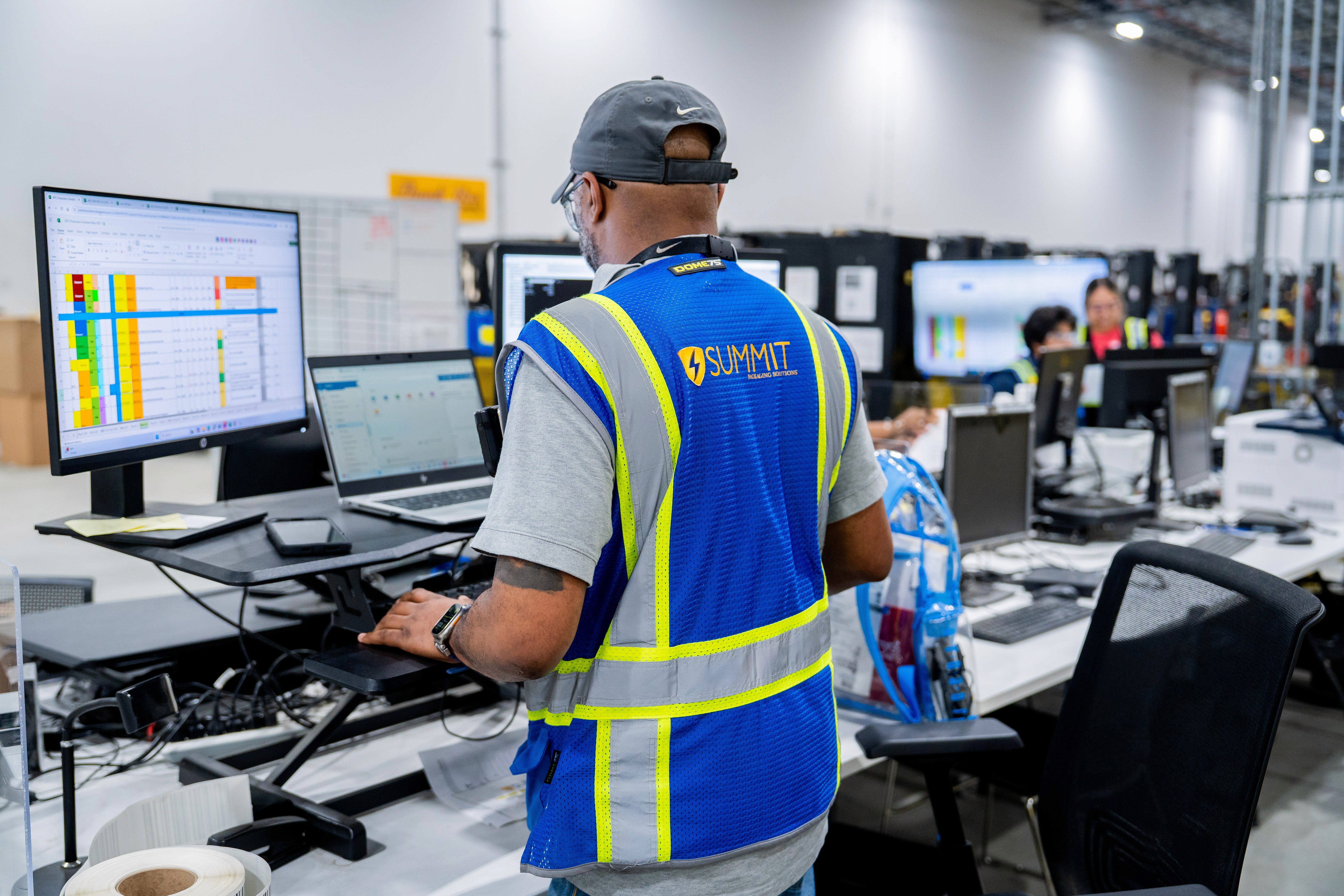 Summit staff tracking the products in the warheouse