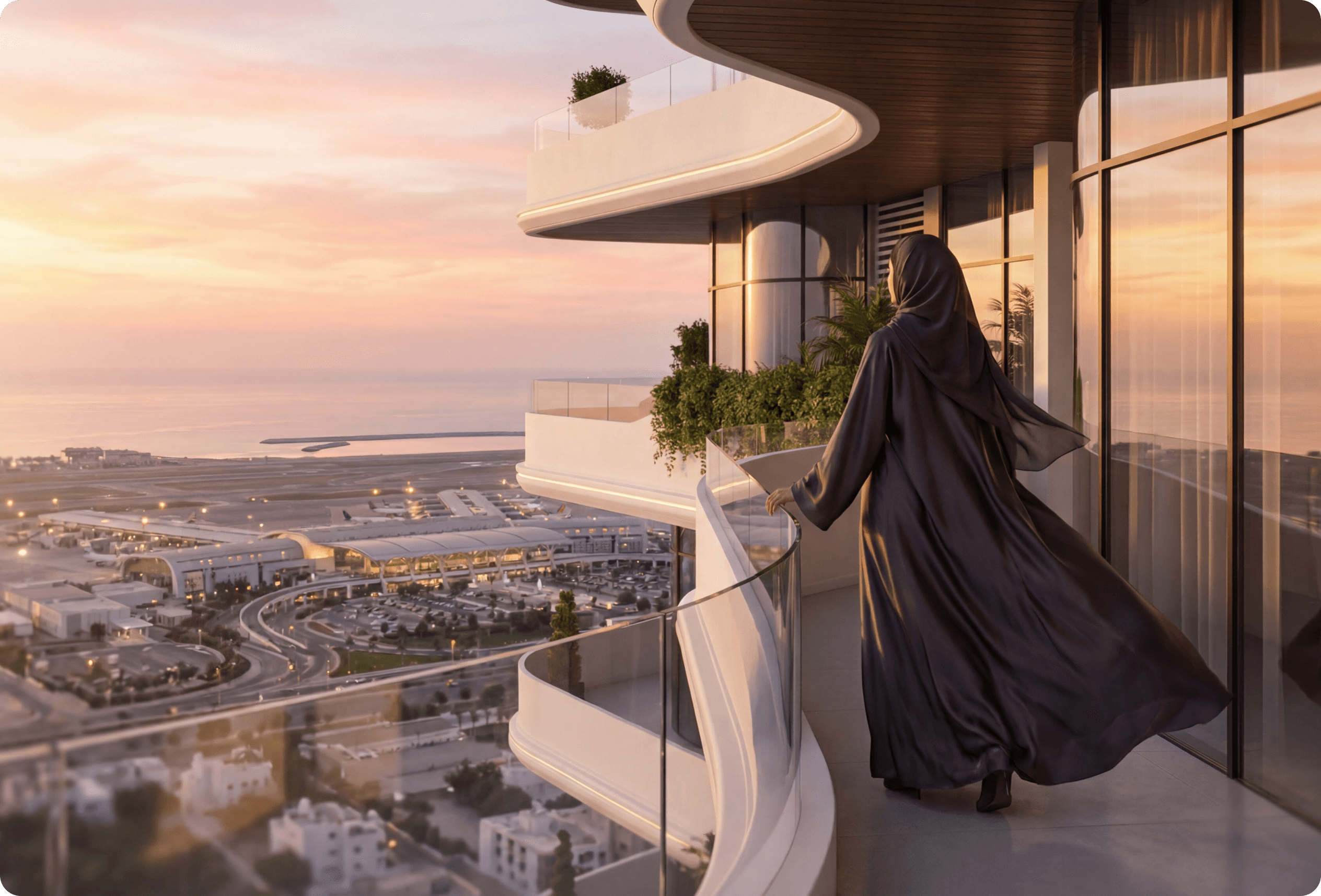 A person stands in The Hills Gate Muscat building overlooking the citya black cloak stands on a balcony, gazing at a city skyline during sunset.