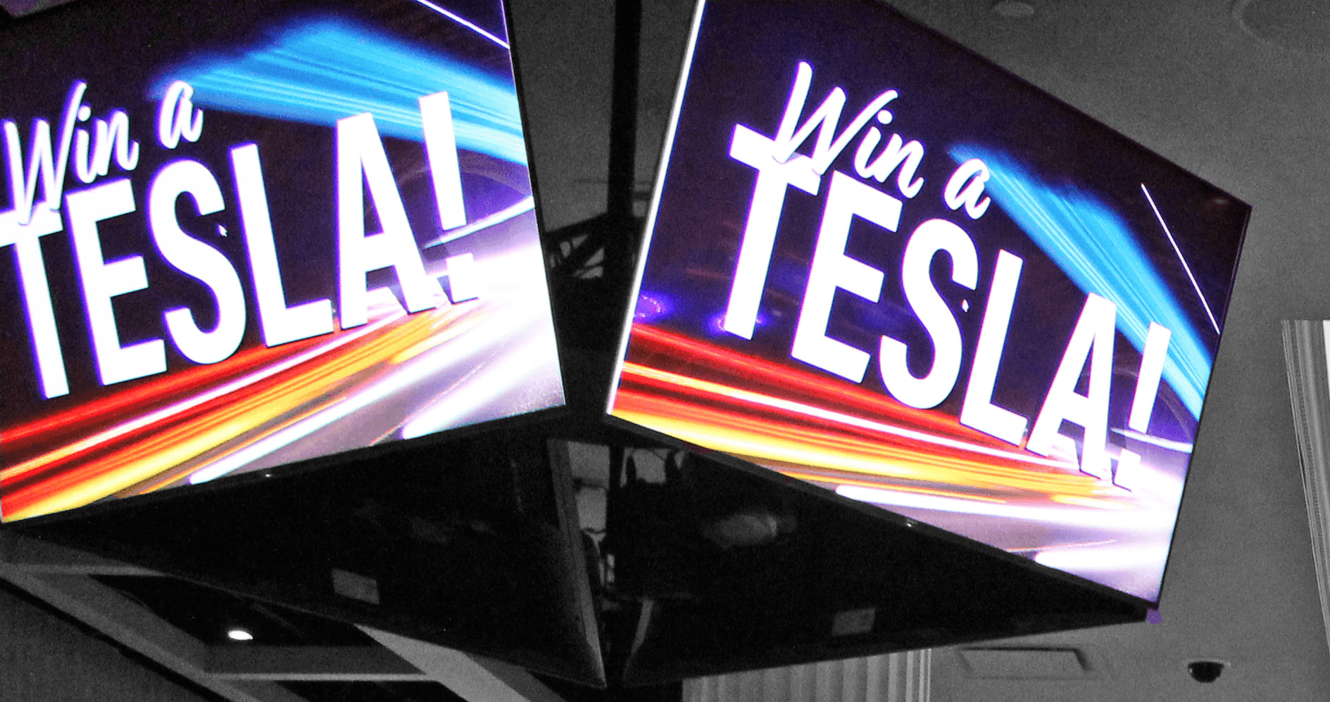 Photo of two screen promoting a car competition