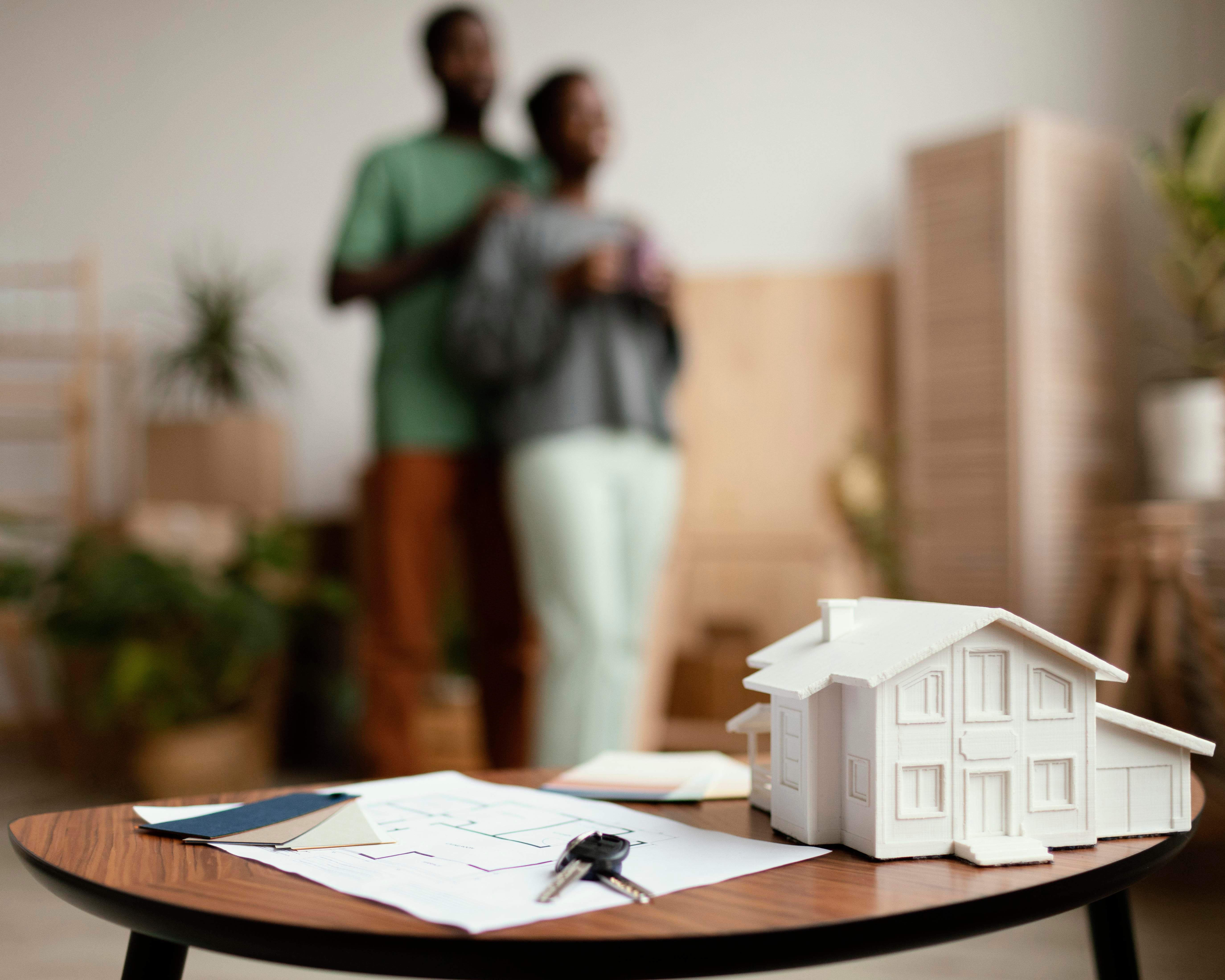 new home keys with defocused couple in the background