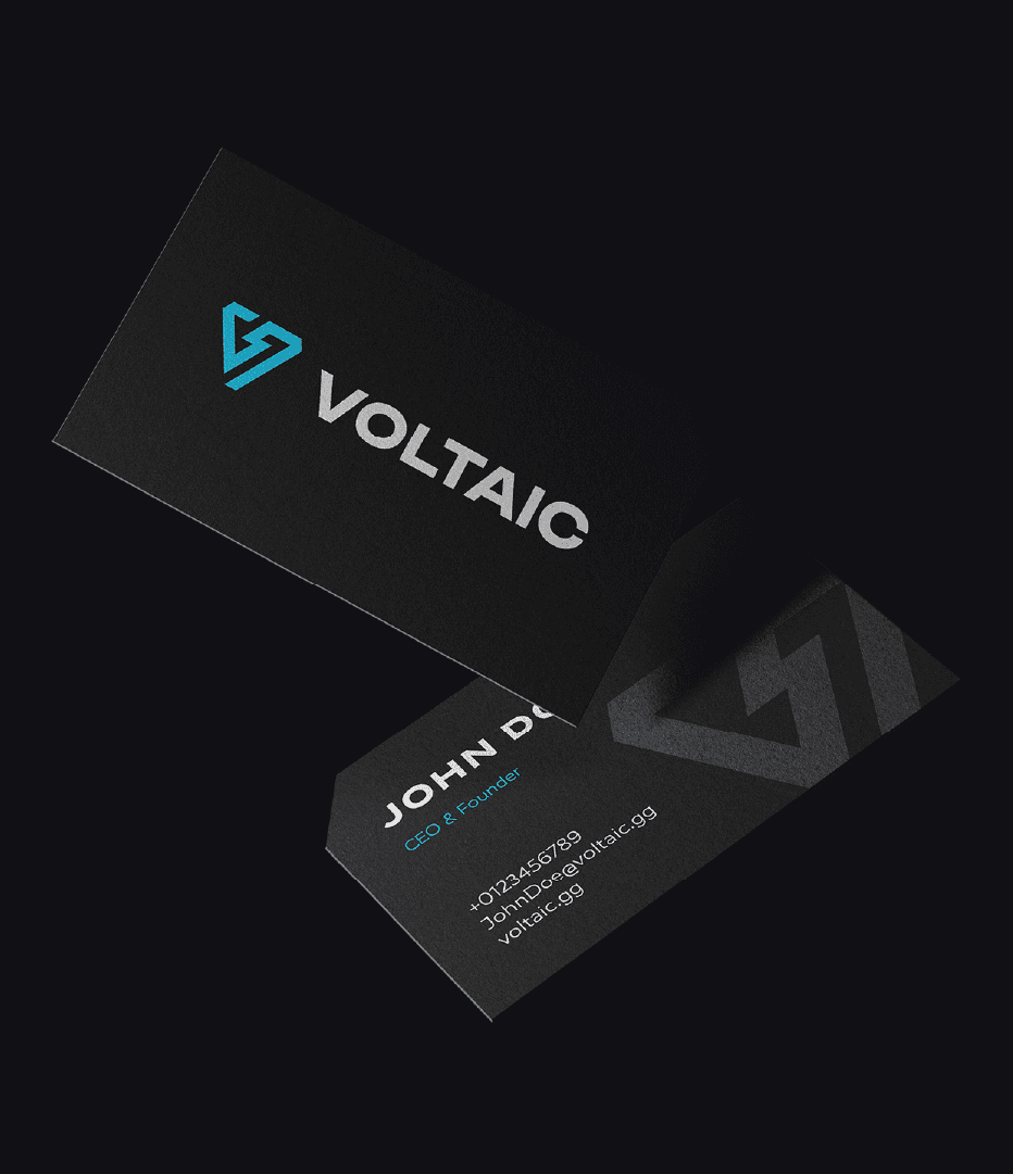 Black Voltaic business cards with the cyan logo on one side and contact details on the other