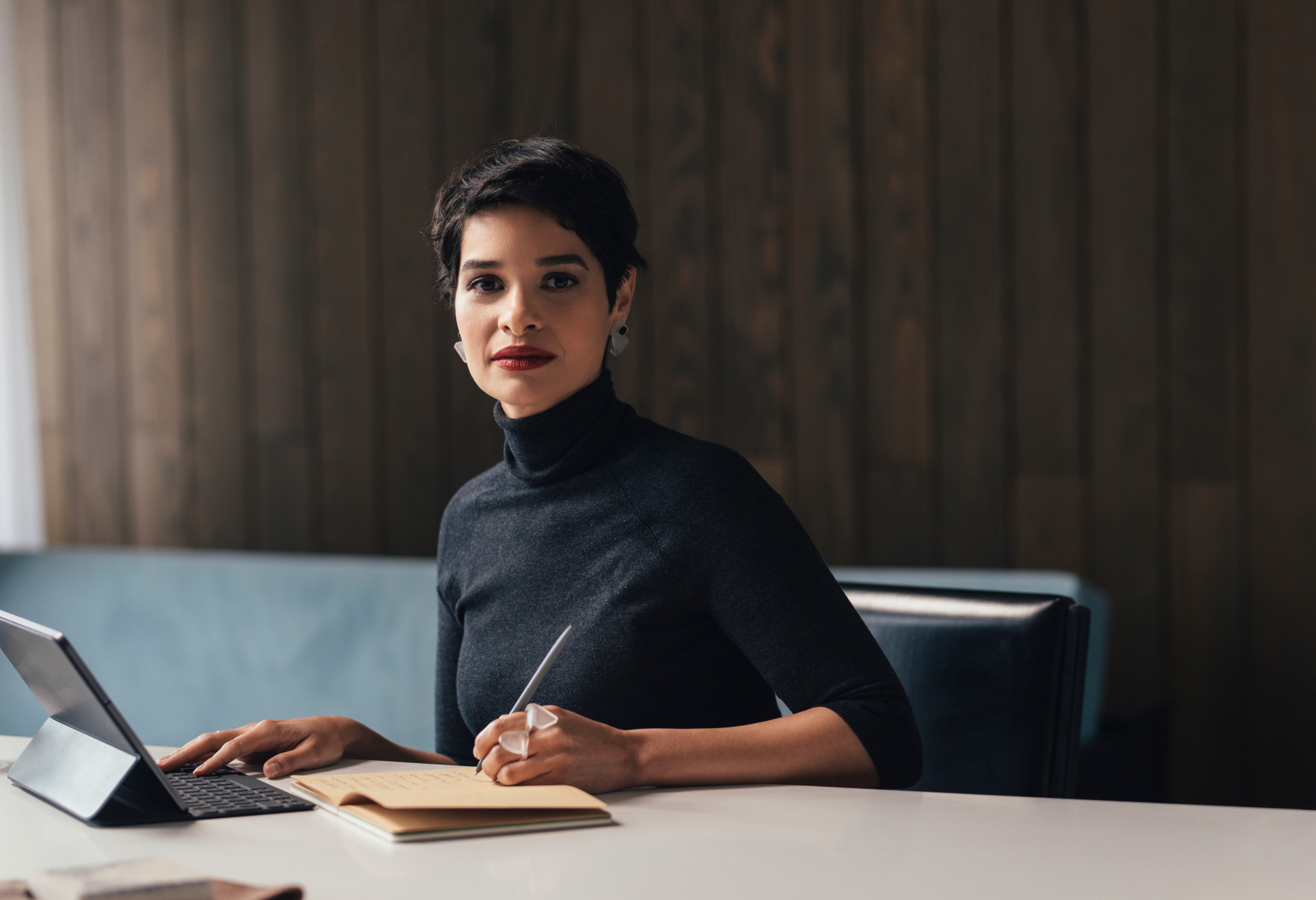 woman with short hair looking at camera O1 visa lawyer