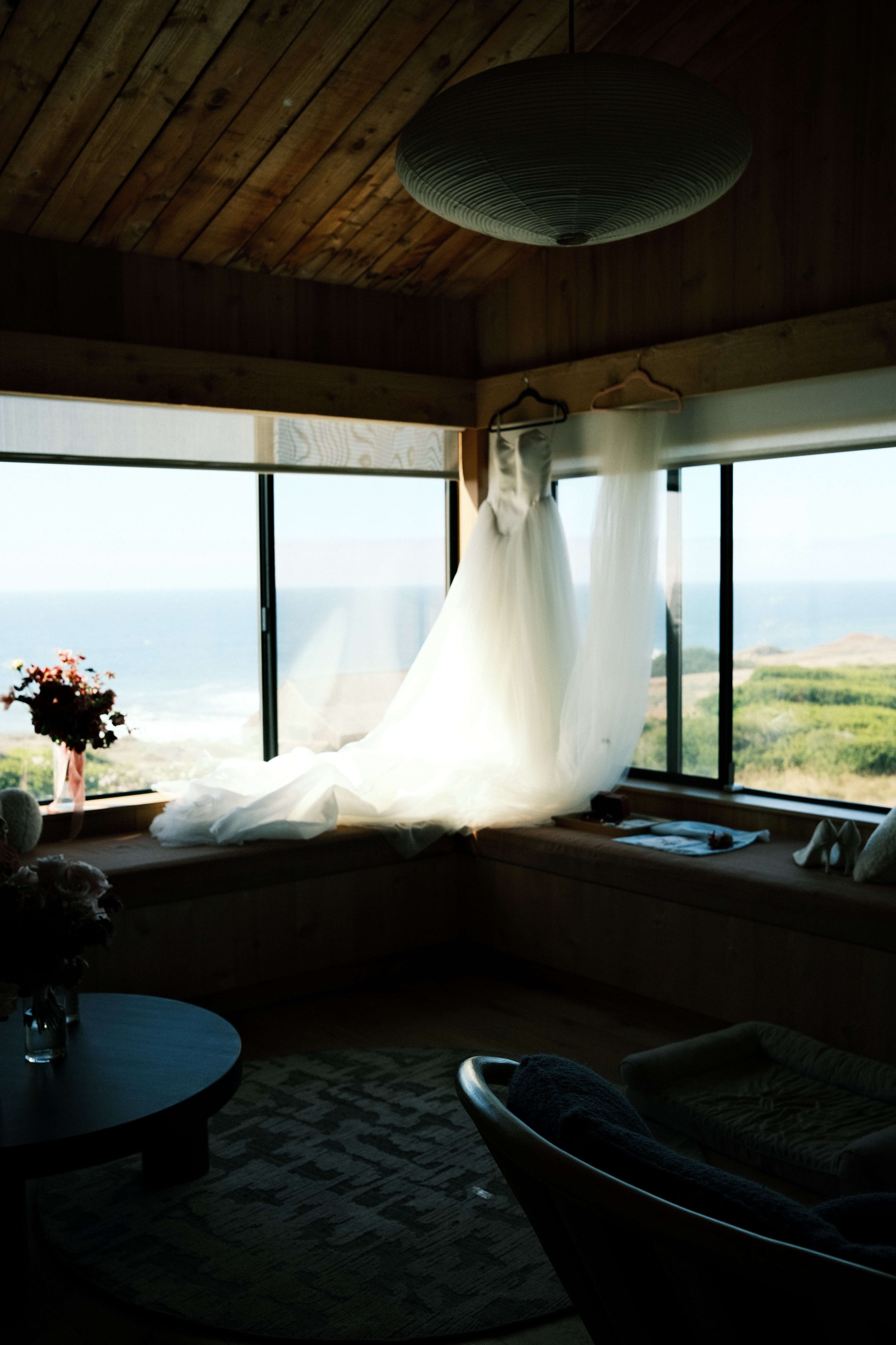 Wedding dress hung by the window