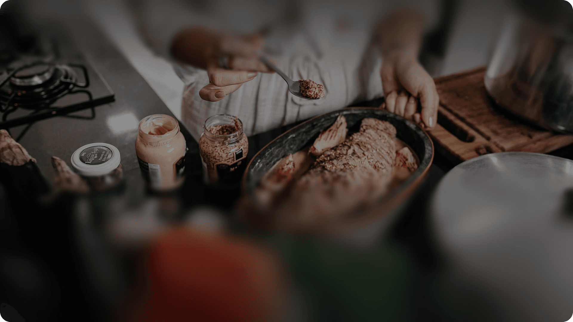 Hands preparing food on a kitchen counter