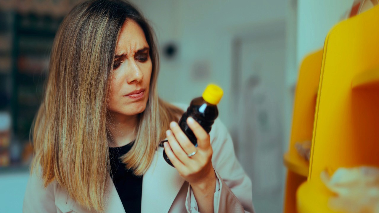 person looking at label