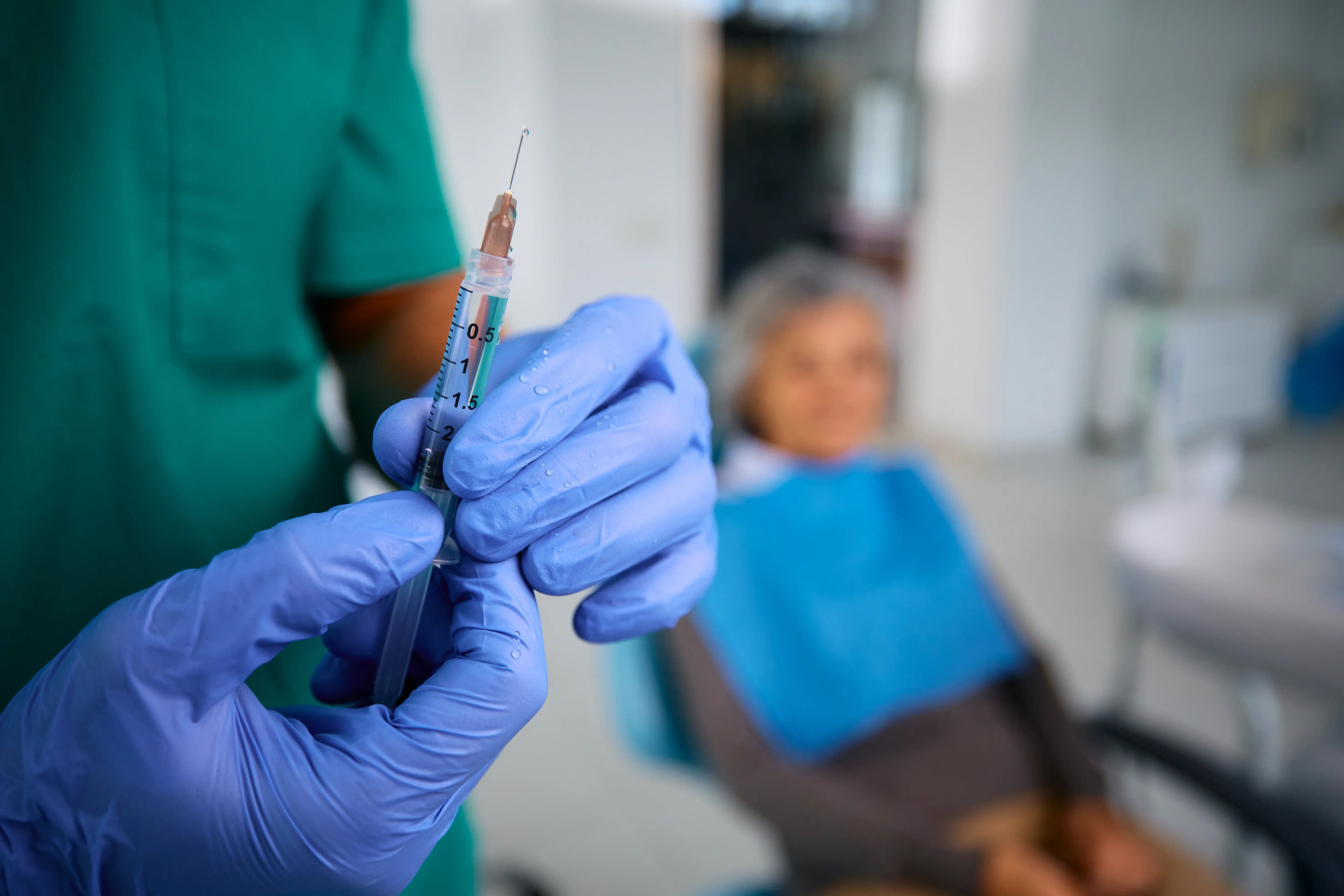 Specialist preparing a therapeutic joint injection for non-surgical pain management