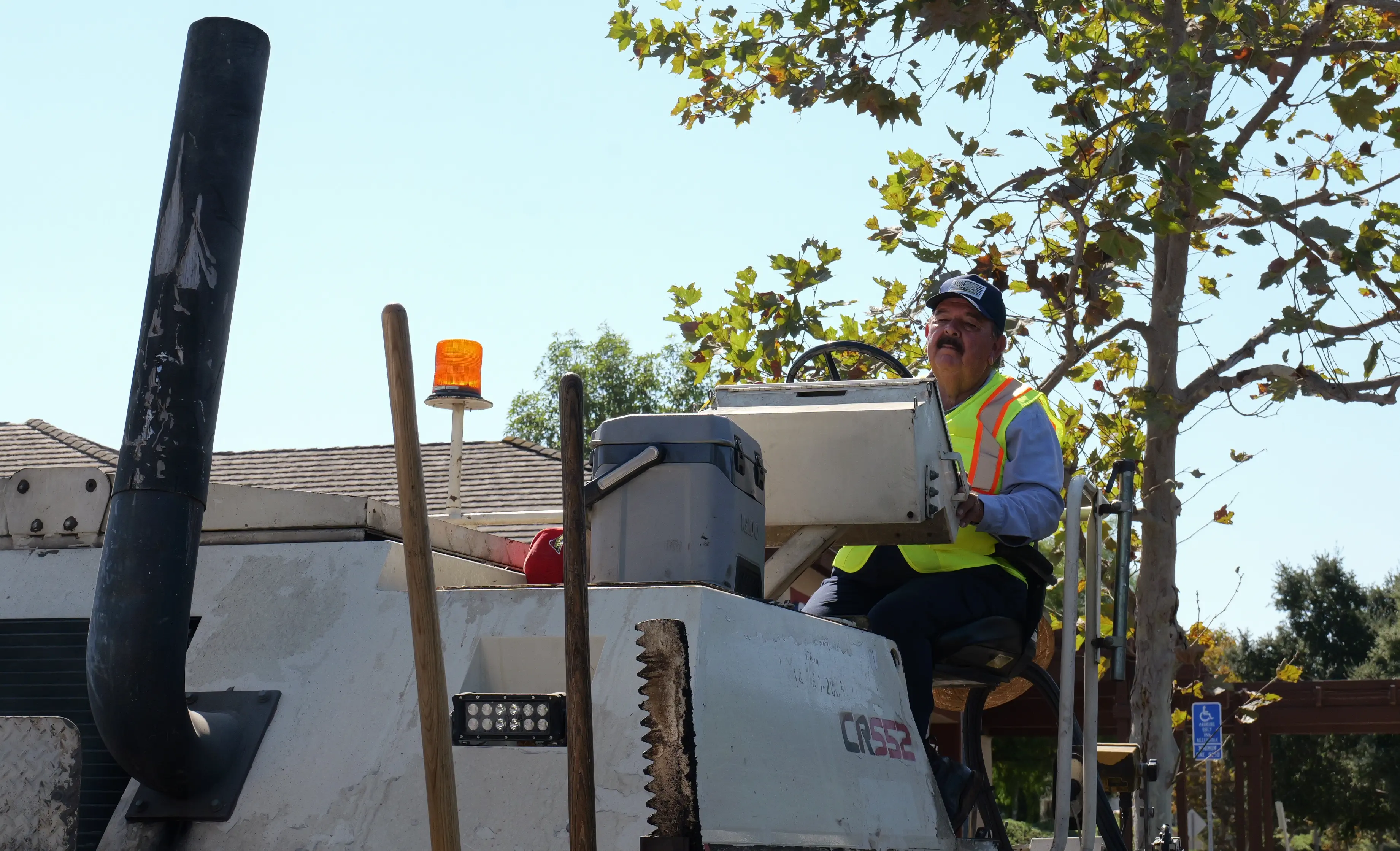 Paving machine operator on asphalt project