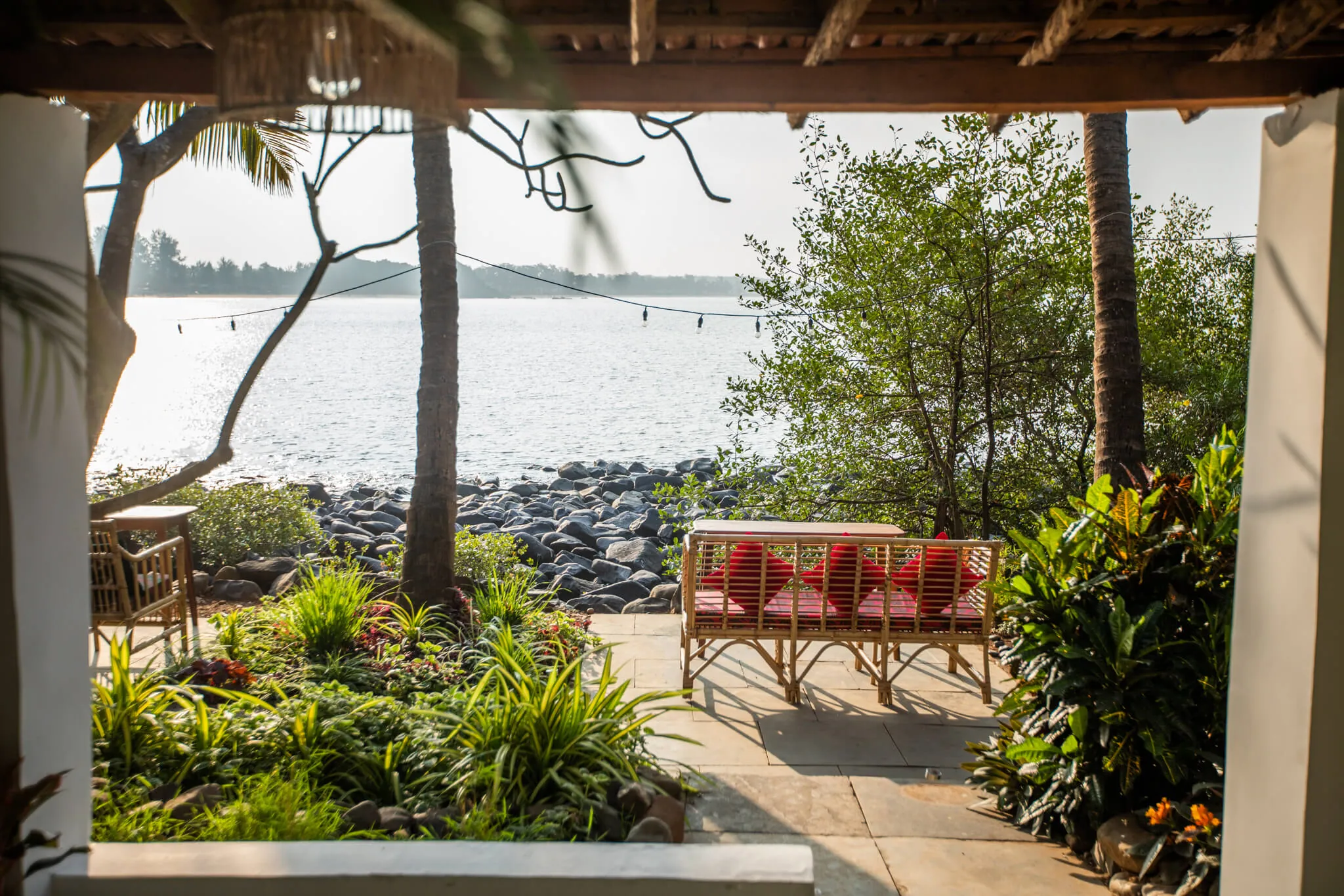 Sea-facing lounge under the pergola at Casa Jaali