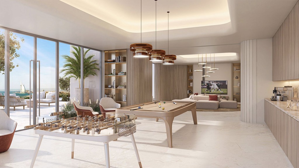 Stylish living room and dining area of a modern apartment in Palm Beach Tower 2, showcasing sleek furnishings and decor.