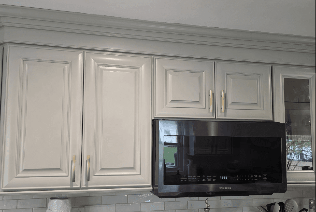 white wooden kitchen cabinet with black pendant lamp