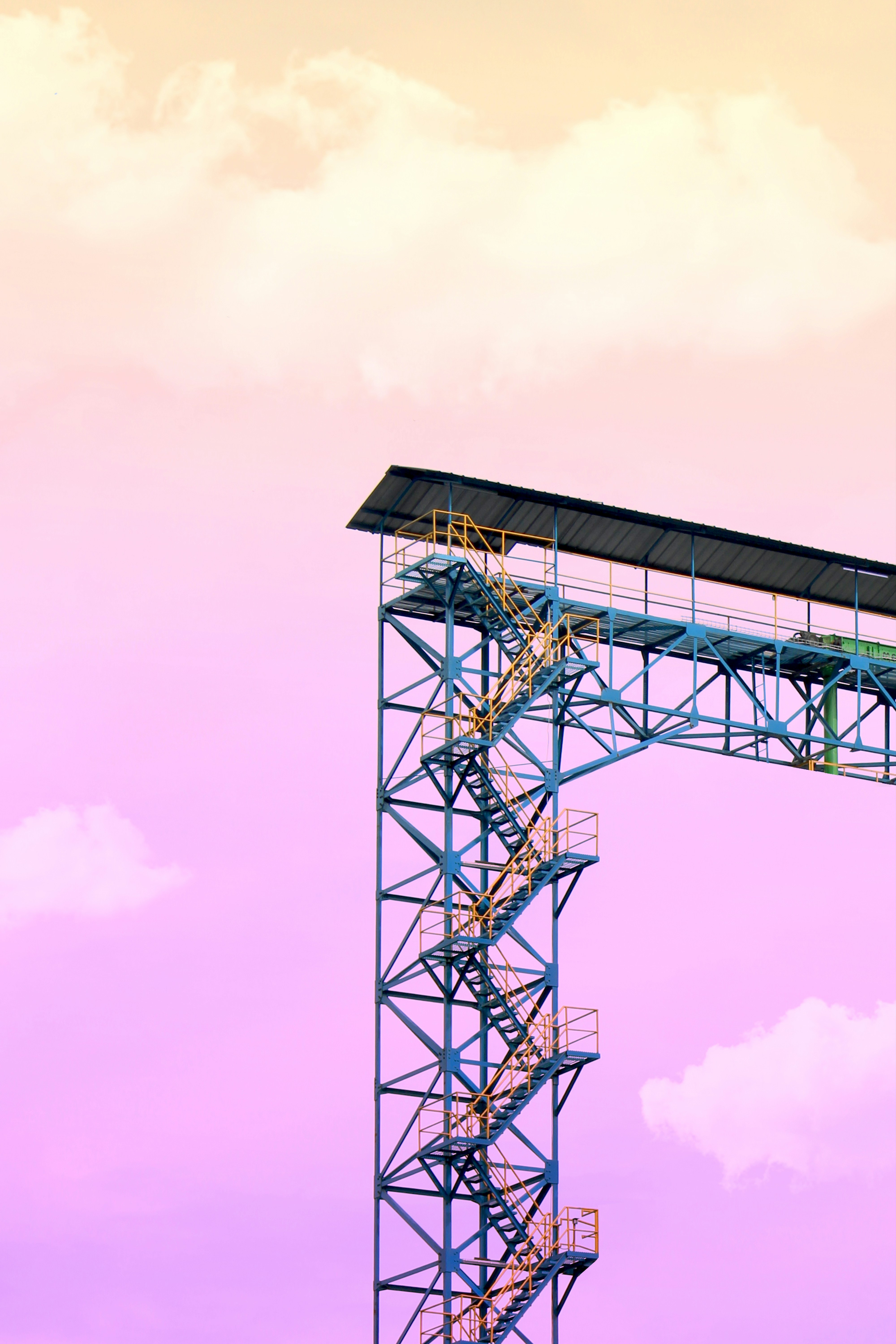 a tall metal structure with a sky background