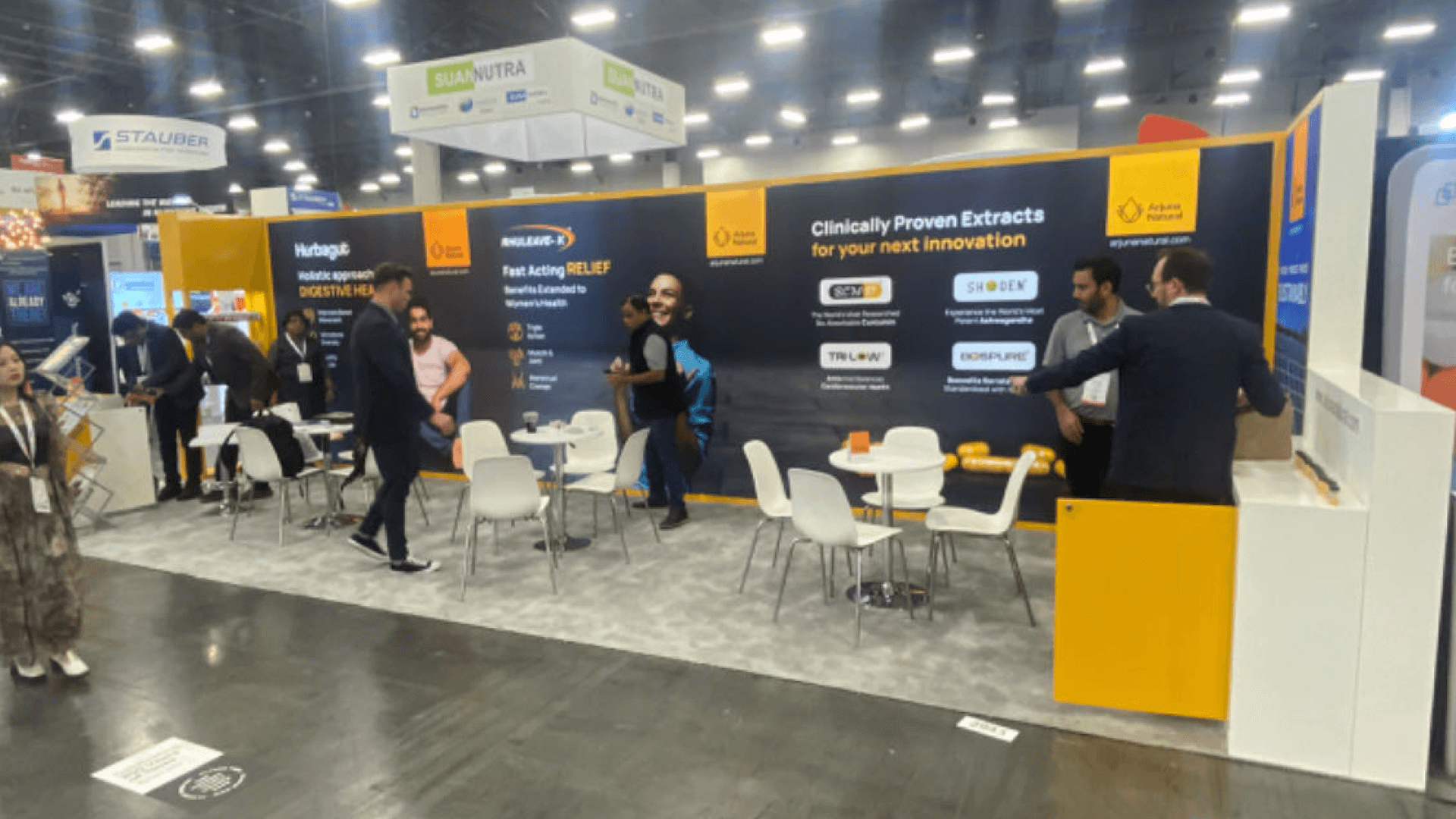 Rental booth installation sequence in Las Vegas with crate staging, modular wall setup, demo counter placement, and graphics preparation