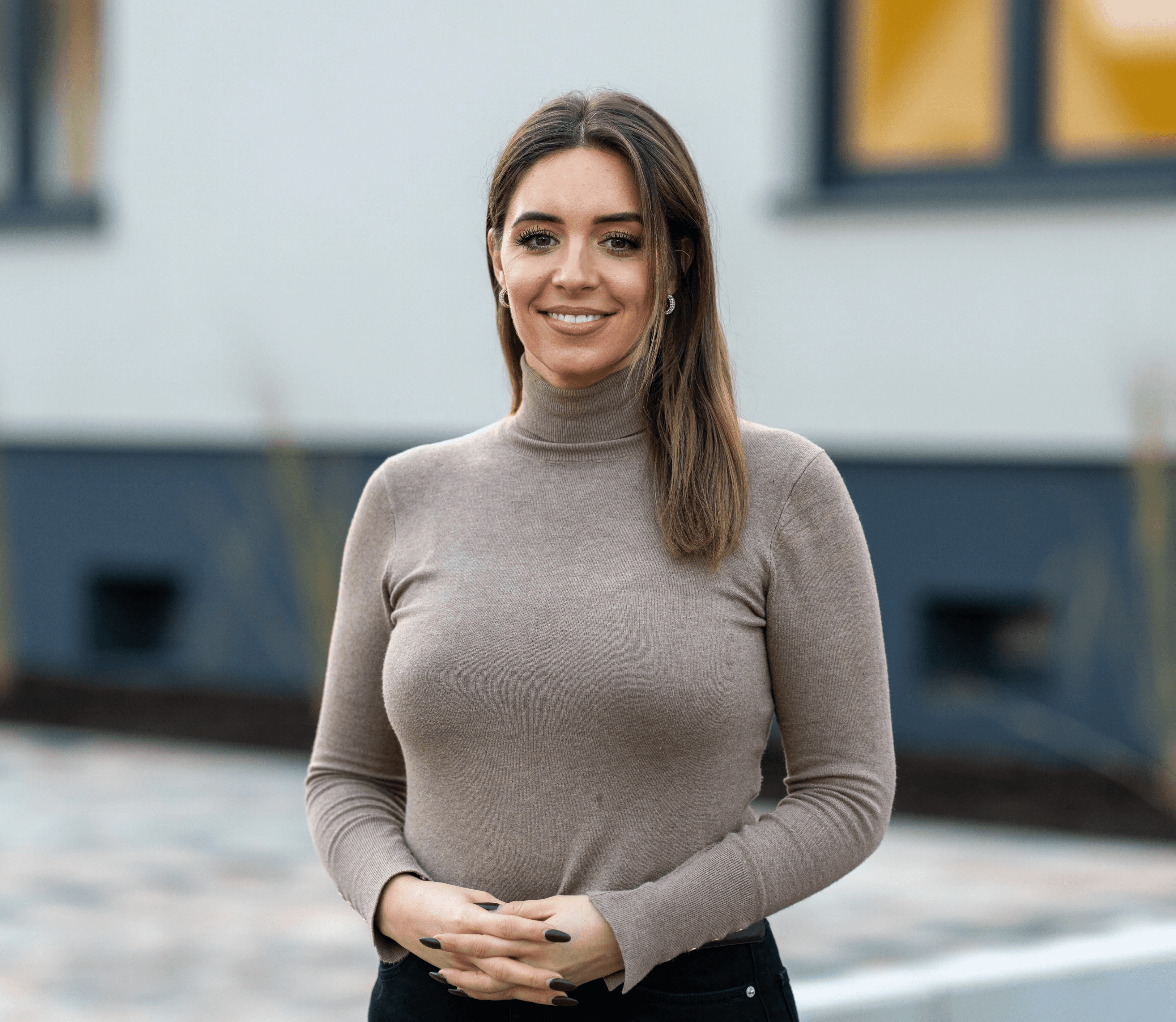 woman in red cardigan smiling