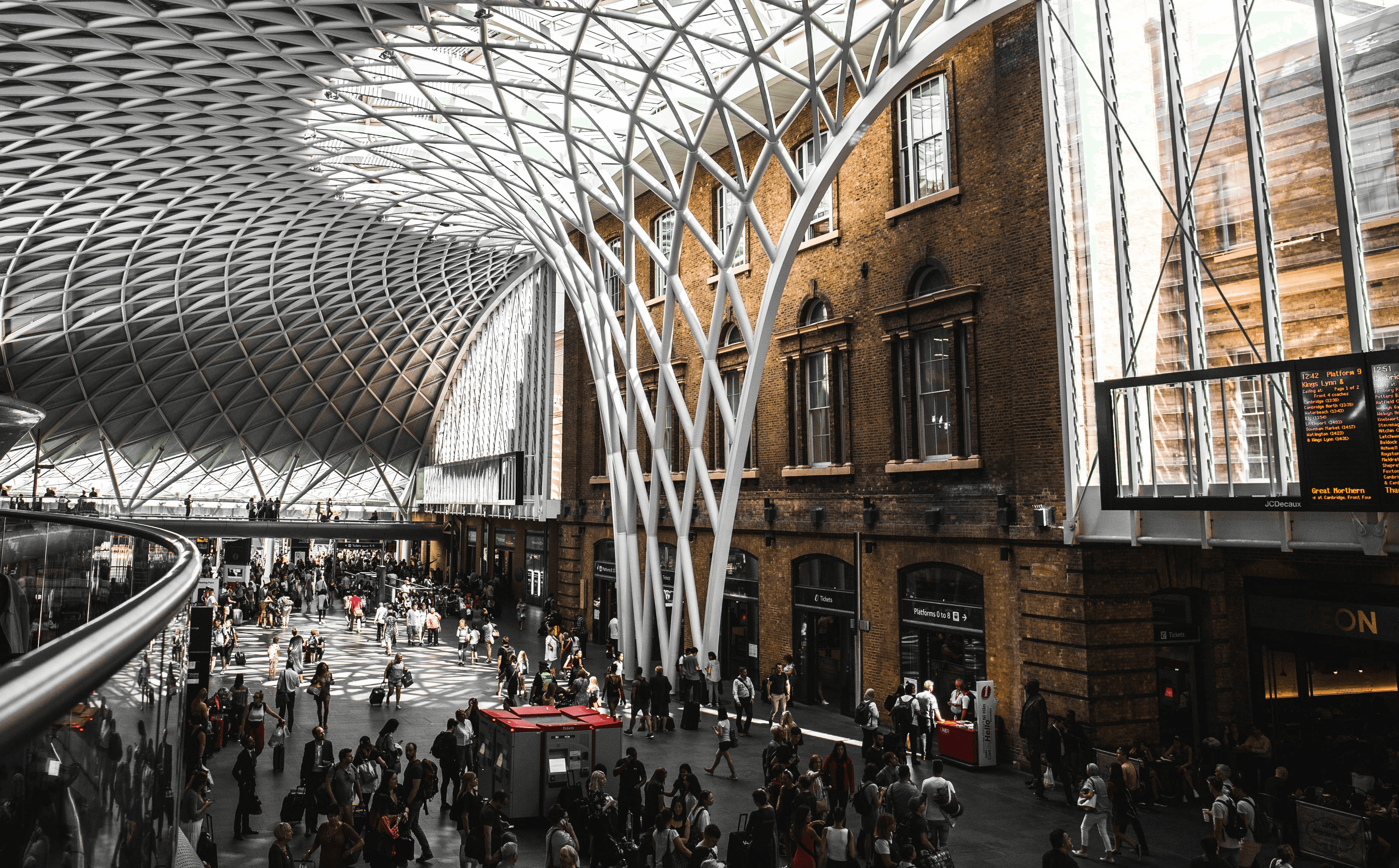 Free Framer Template - A modern building with a sleek, curved glass facade against a blue sky.