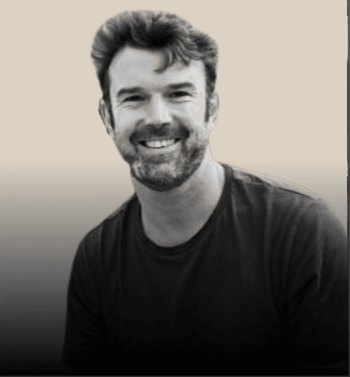 headshot of male in dark background