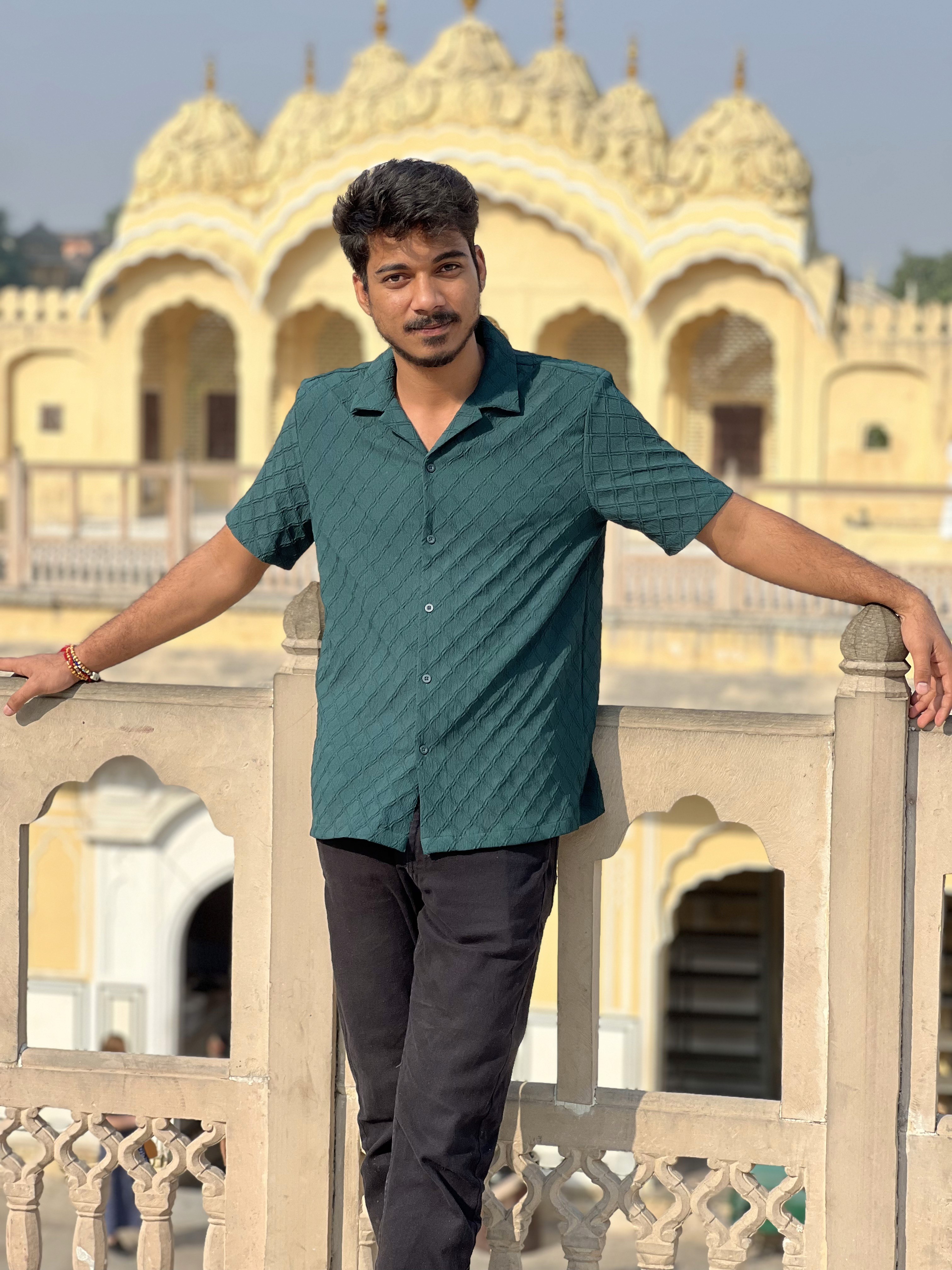 a group of people standing on top of a sandy beach