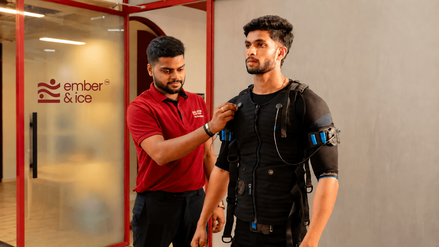Man using WB-EMS technology for full-body strength and conditioning training at Ember & Ice Health wellness center.