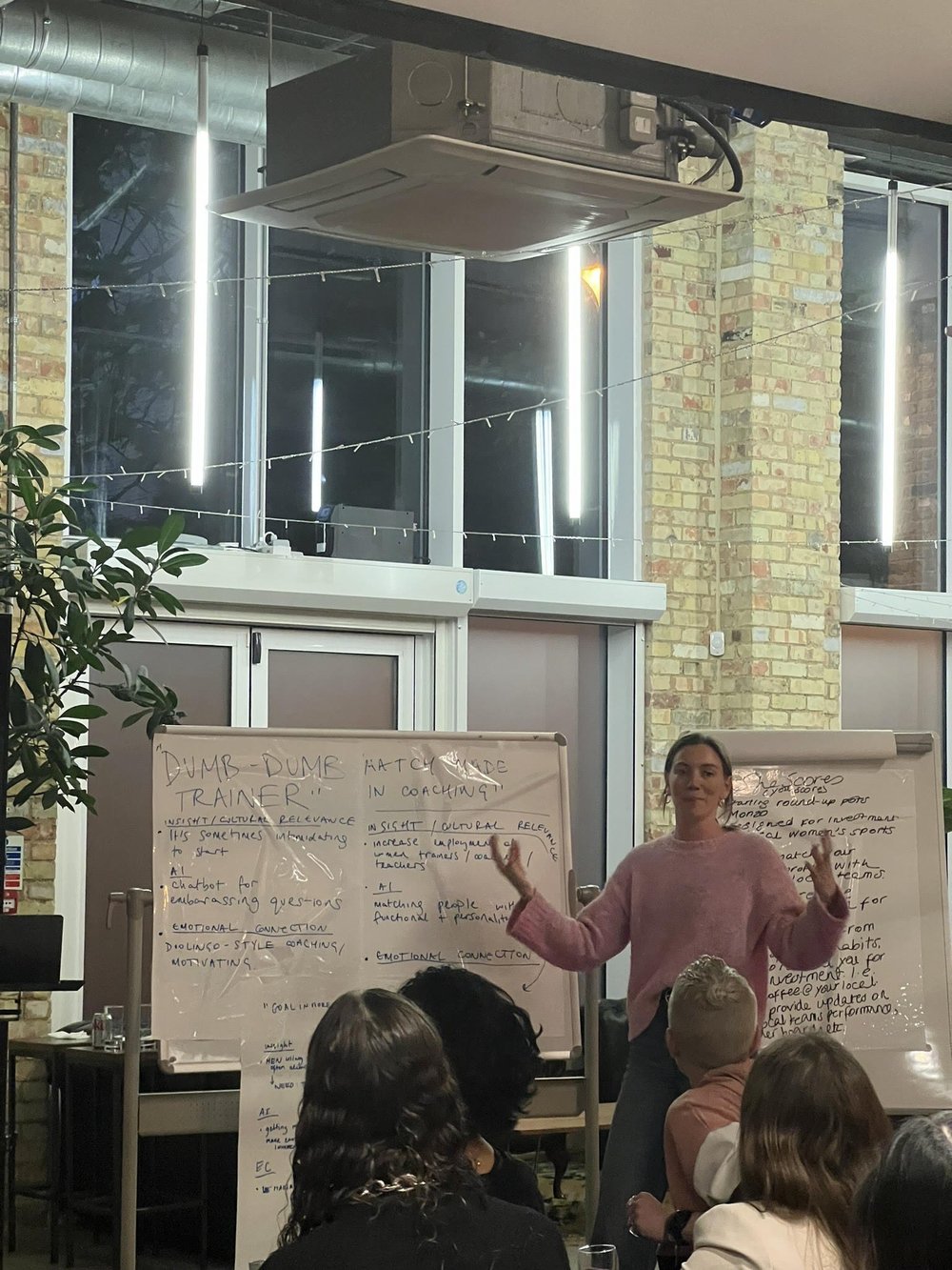 Presenter pitching ideas in front of a crowd