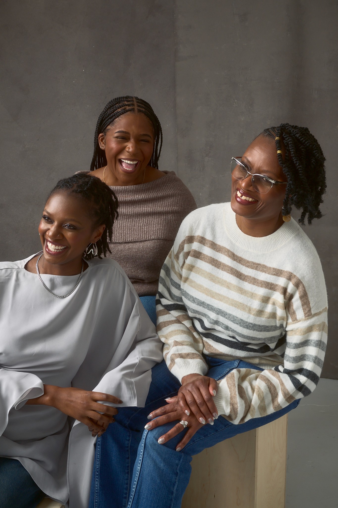 person sitting on grass and using phone