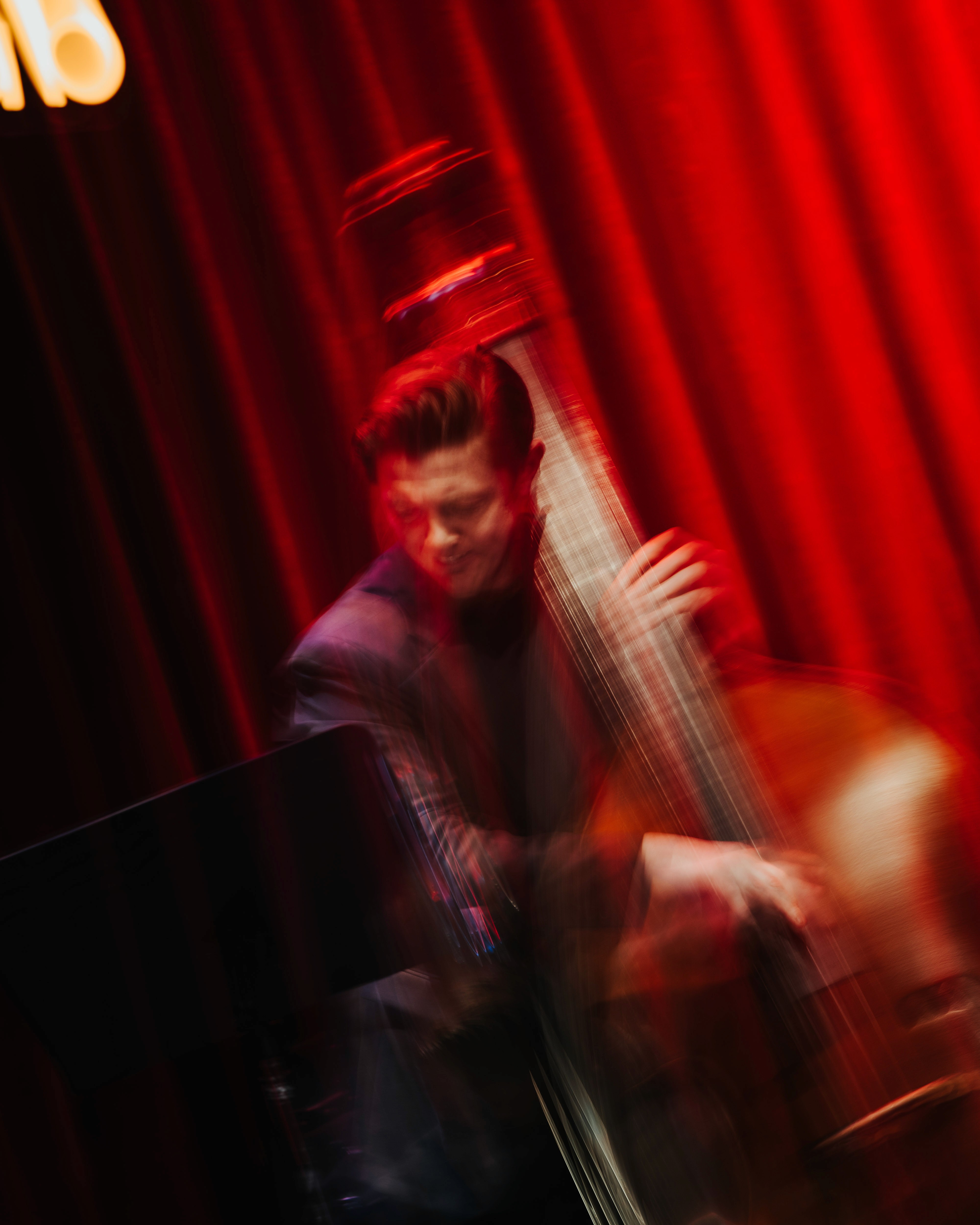 Male sailor from the ACS Independent team focused on steering his boat during the A Division race action.