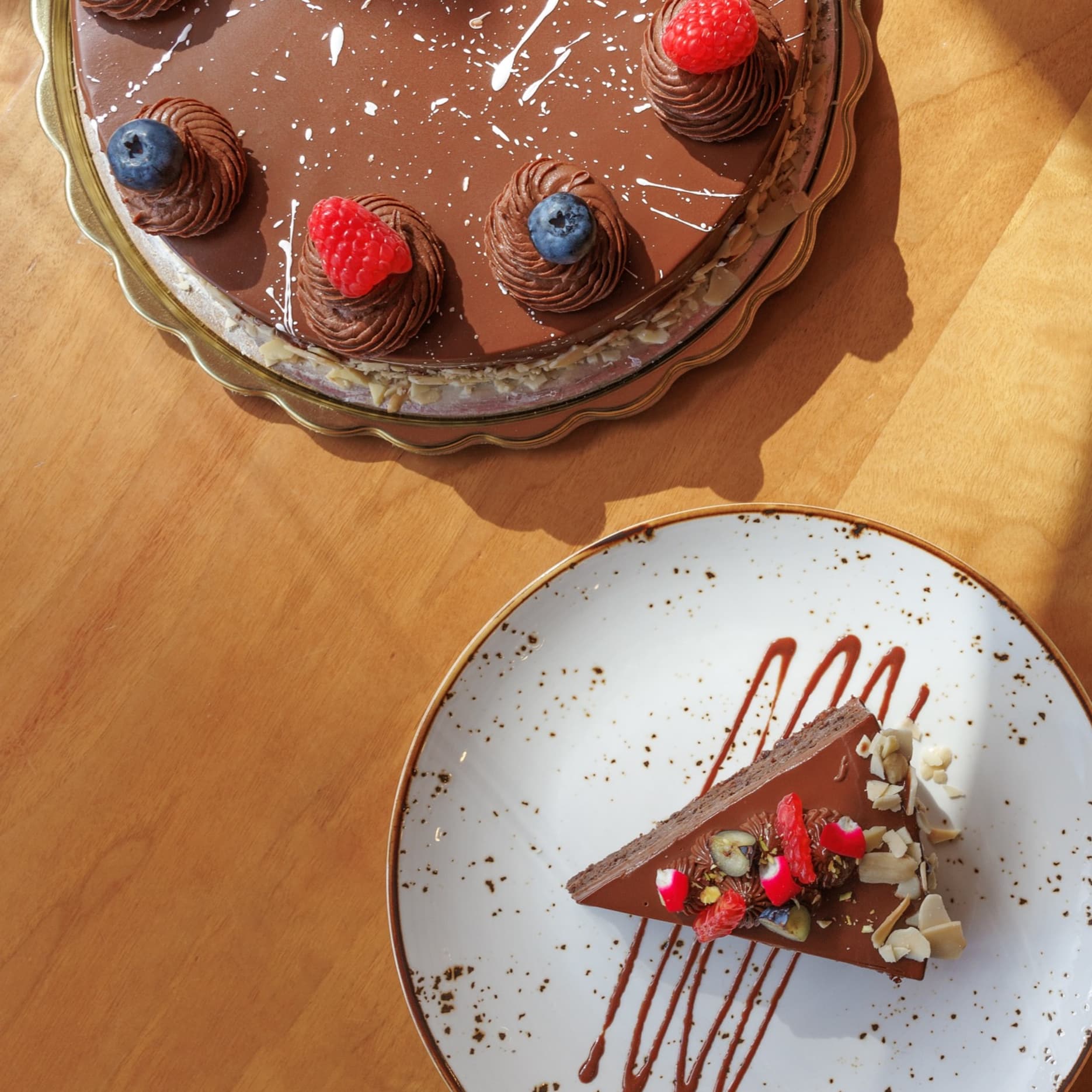 Vegan food called So Much Fudge dessert with rich chocolate layers, smooth dairy-free cream, and an indulgent, silky texture.