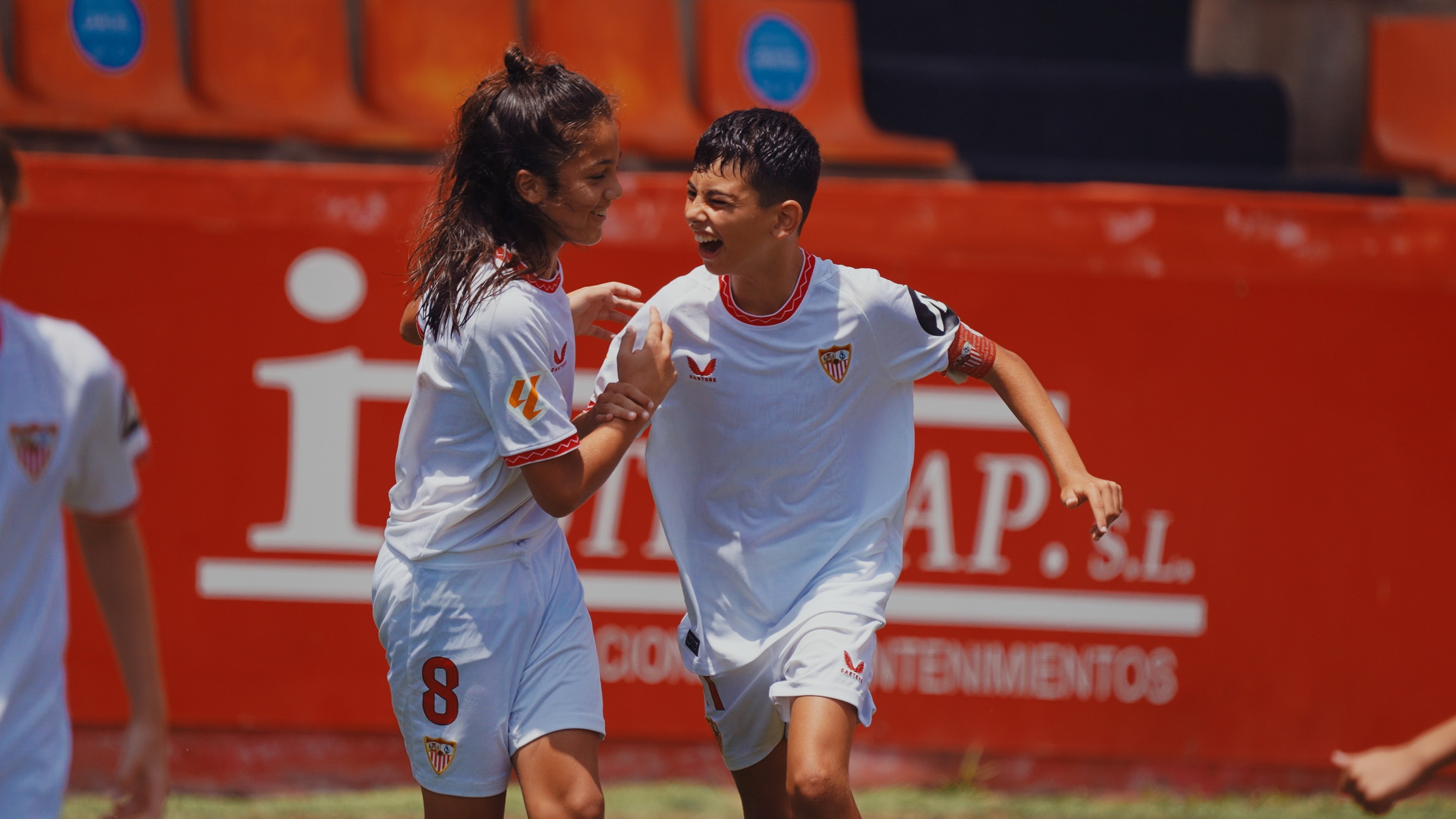 Two men wearing yellow and black face masks, standing side by side, with neutral expressions on their faces.