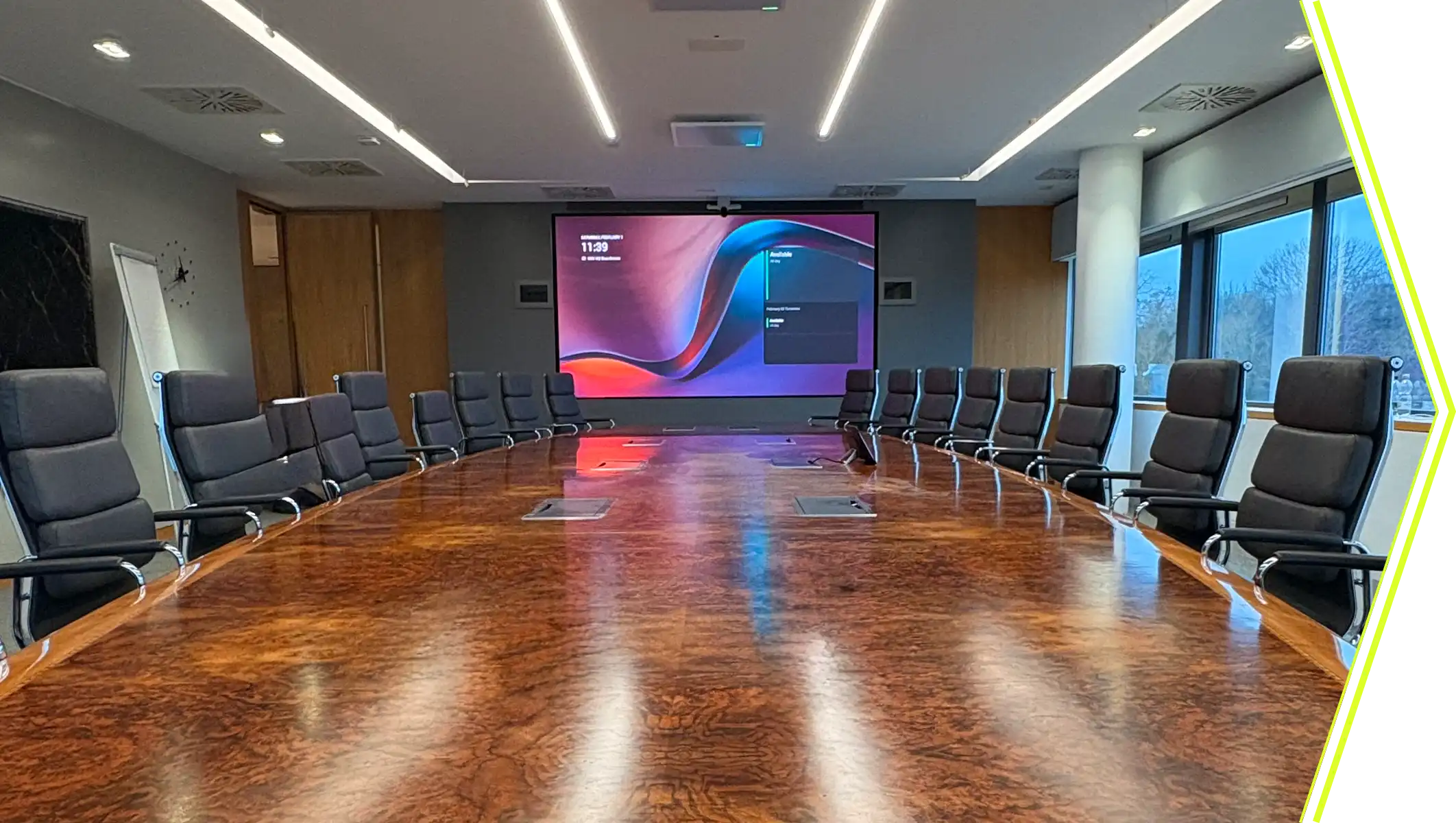 Corporate boardroom with large presentation display