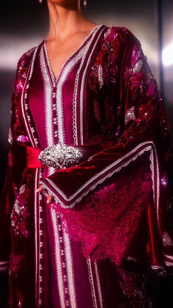 Fuchsia Moroccan caftan with sculptural sleeves and intricate embroidery, bold handcrafted couture piece in Bahrain