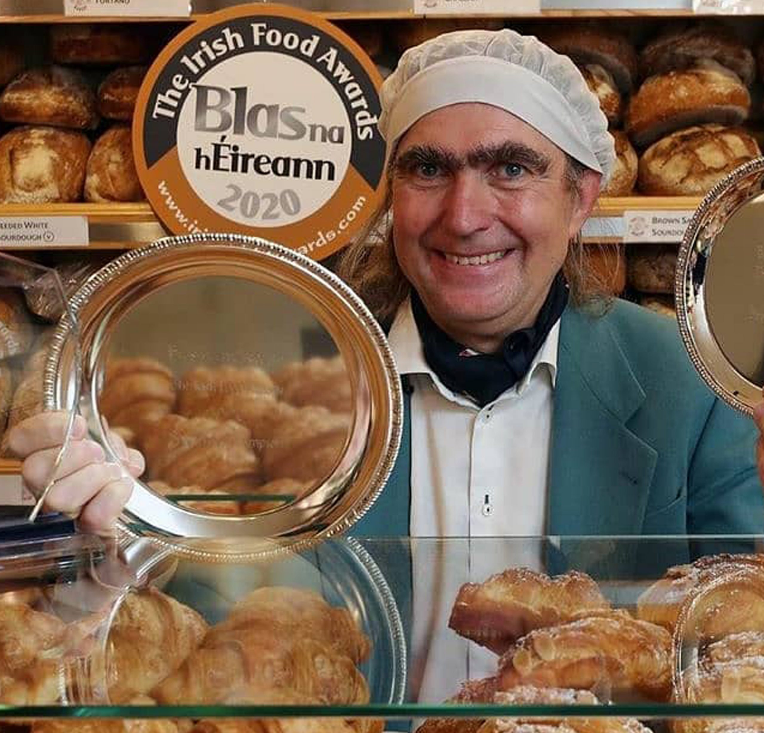 Owner of The Bretzel Bakery smiling and showing their Bretzels while supplying them to As One Restaurant Dublin