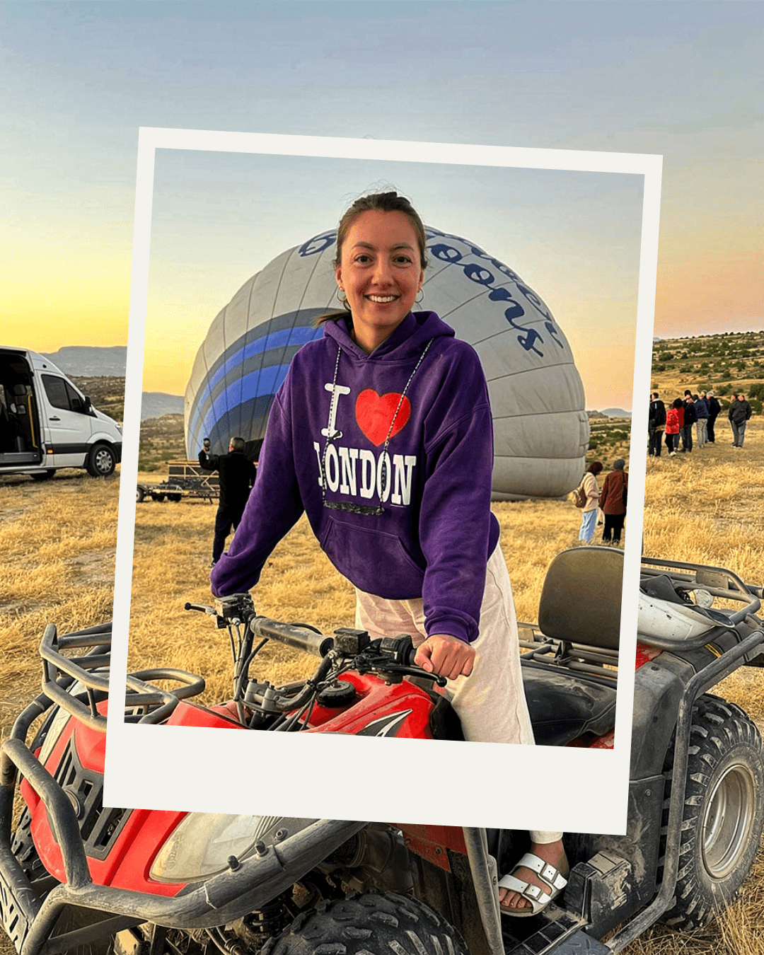 Three local guides smiling during sunset in AlUla desert, representing the tour team.