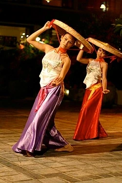 Traditional dancers in conical hats