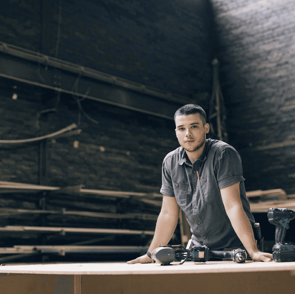 image of young man at workbench