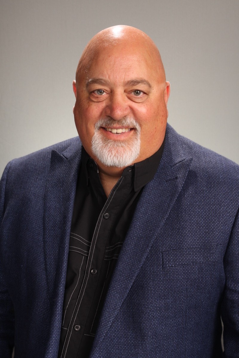 man using smartphone on chair
