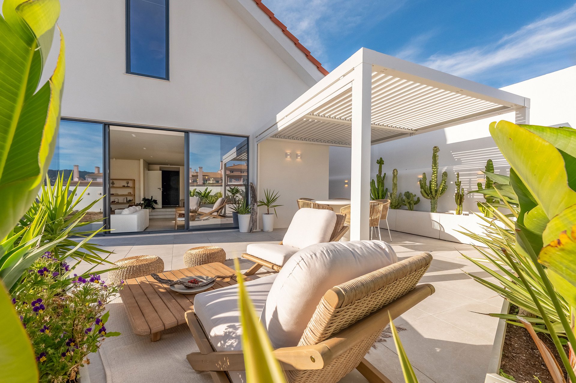 Terrace with pergola and lounge chairs at Villa Flora