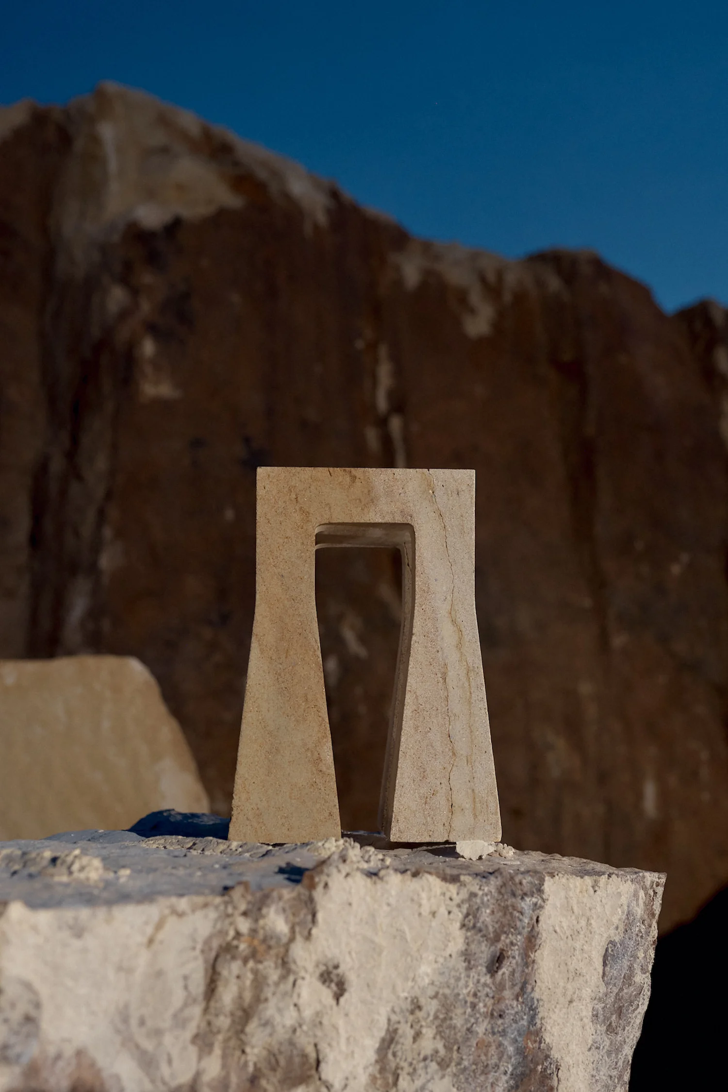 Handcrafted Sand Lada stool in natural quartz sandstone, made in the Czech Republic