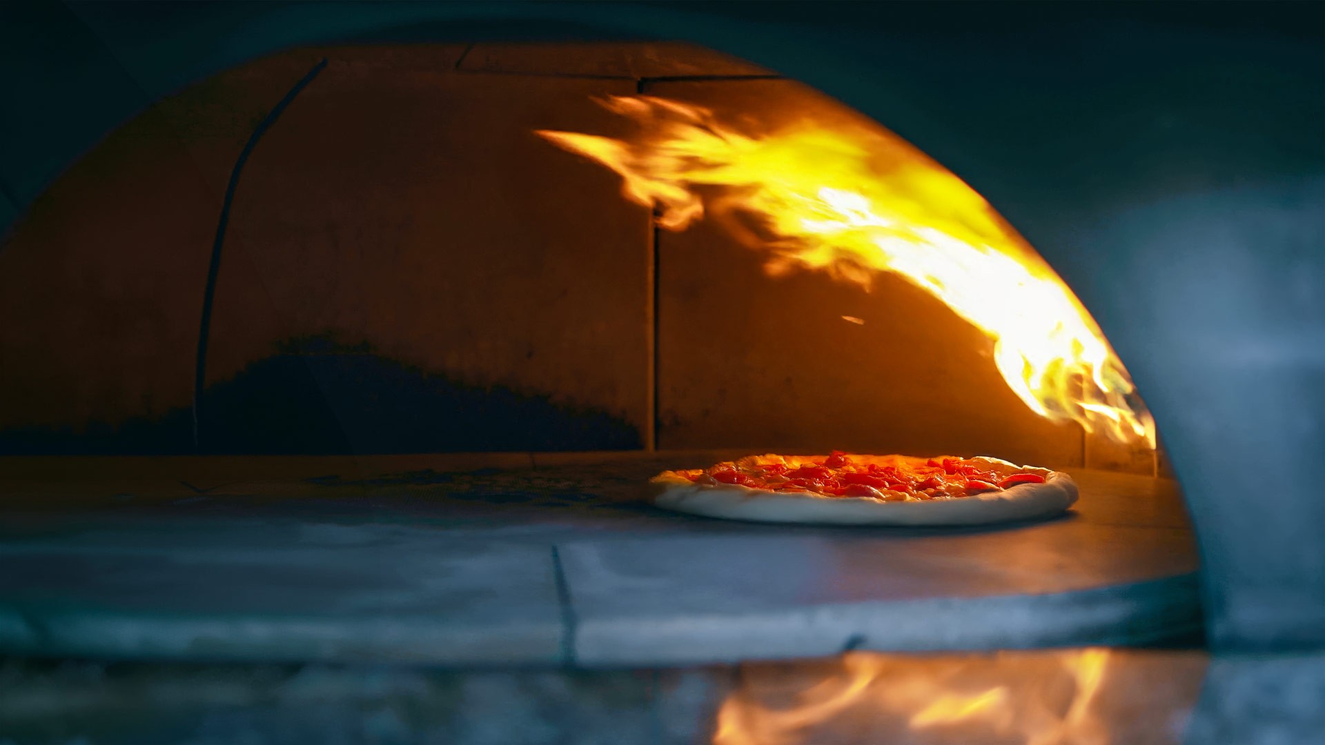 Close-up of the estate’s wood-fired pizza oven used for private dining and chef-led service.