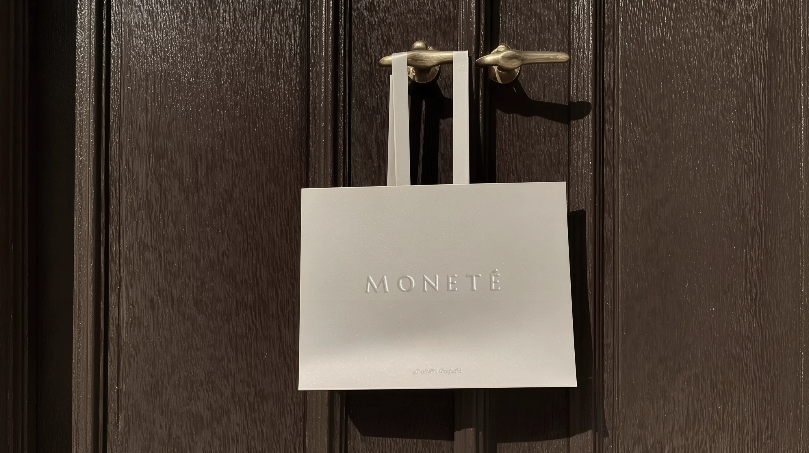 Branded paper shopping bag for jewelry brand with luxury finishes