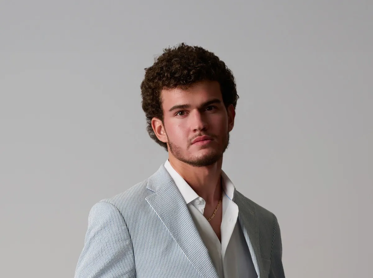 Design portfolio project showing Jeffrey Hakim, Kentucky designer and creative director, in professional attire, showcasing his UI/UX design expertise. designed by Jeffrey Hakim