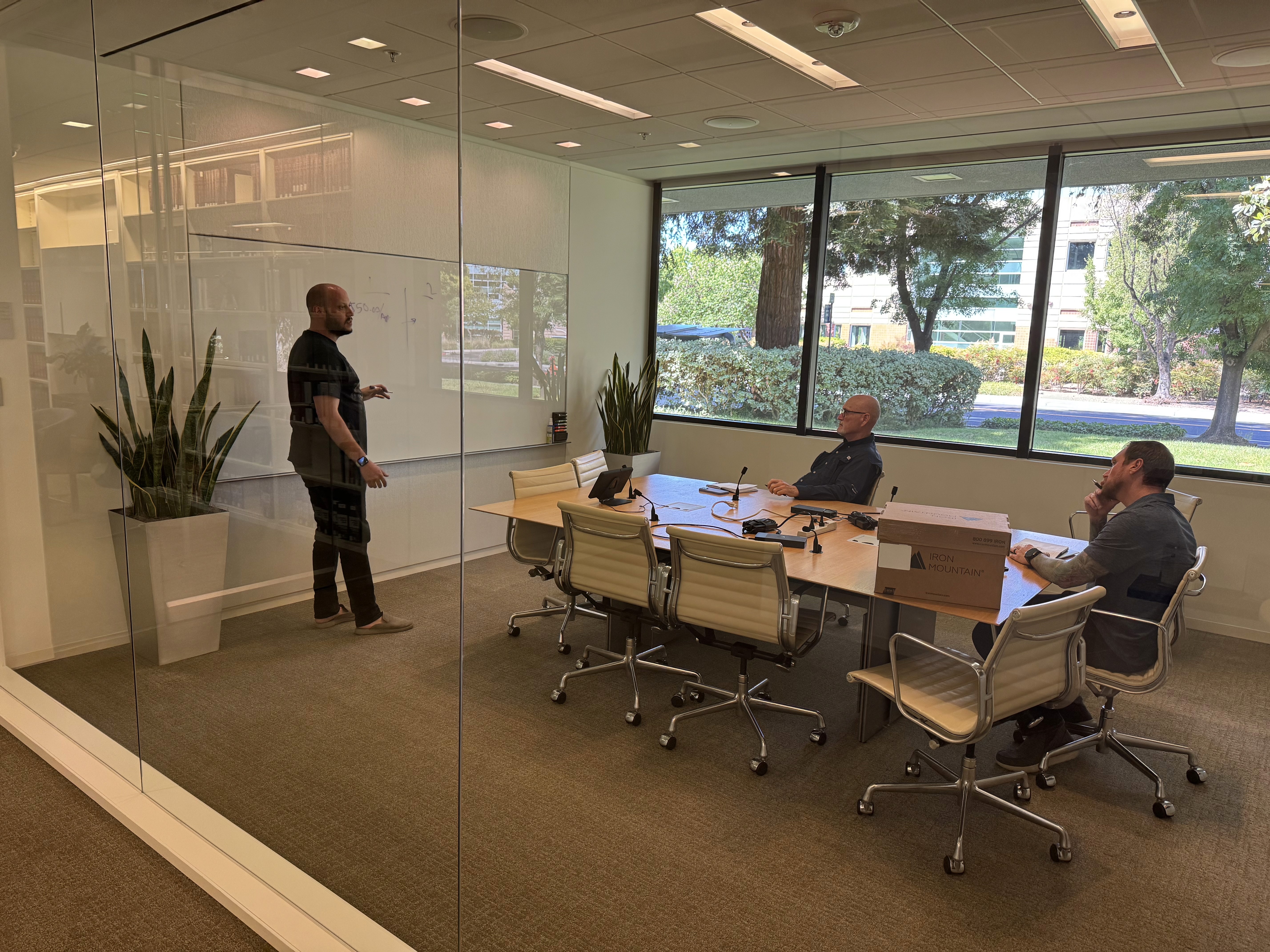 people sitting near table with laptop computer