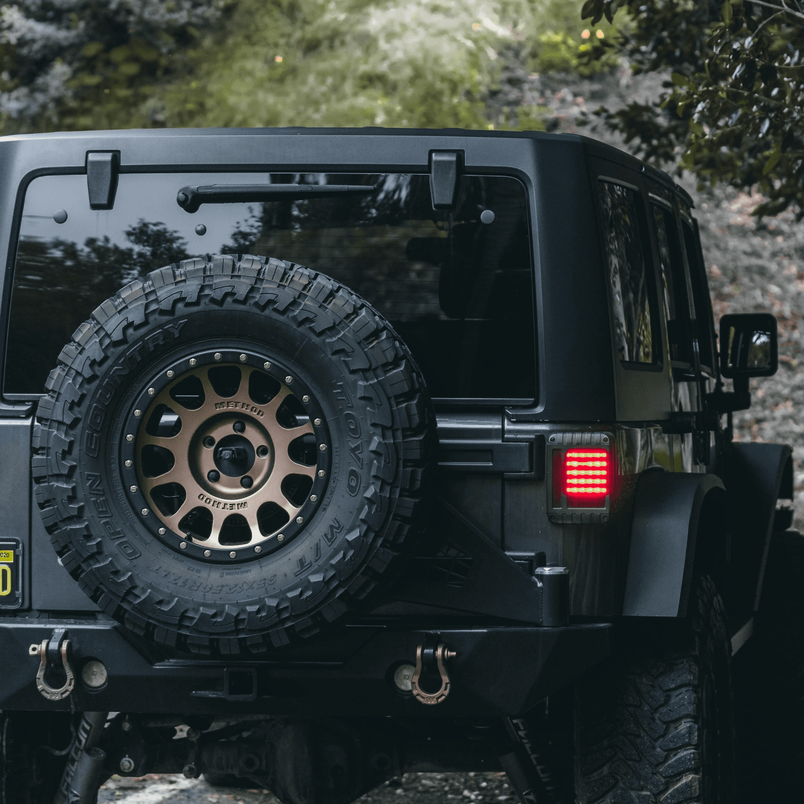 black jeep wrangler on dirt road during daytime