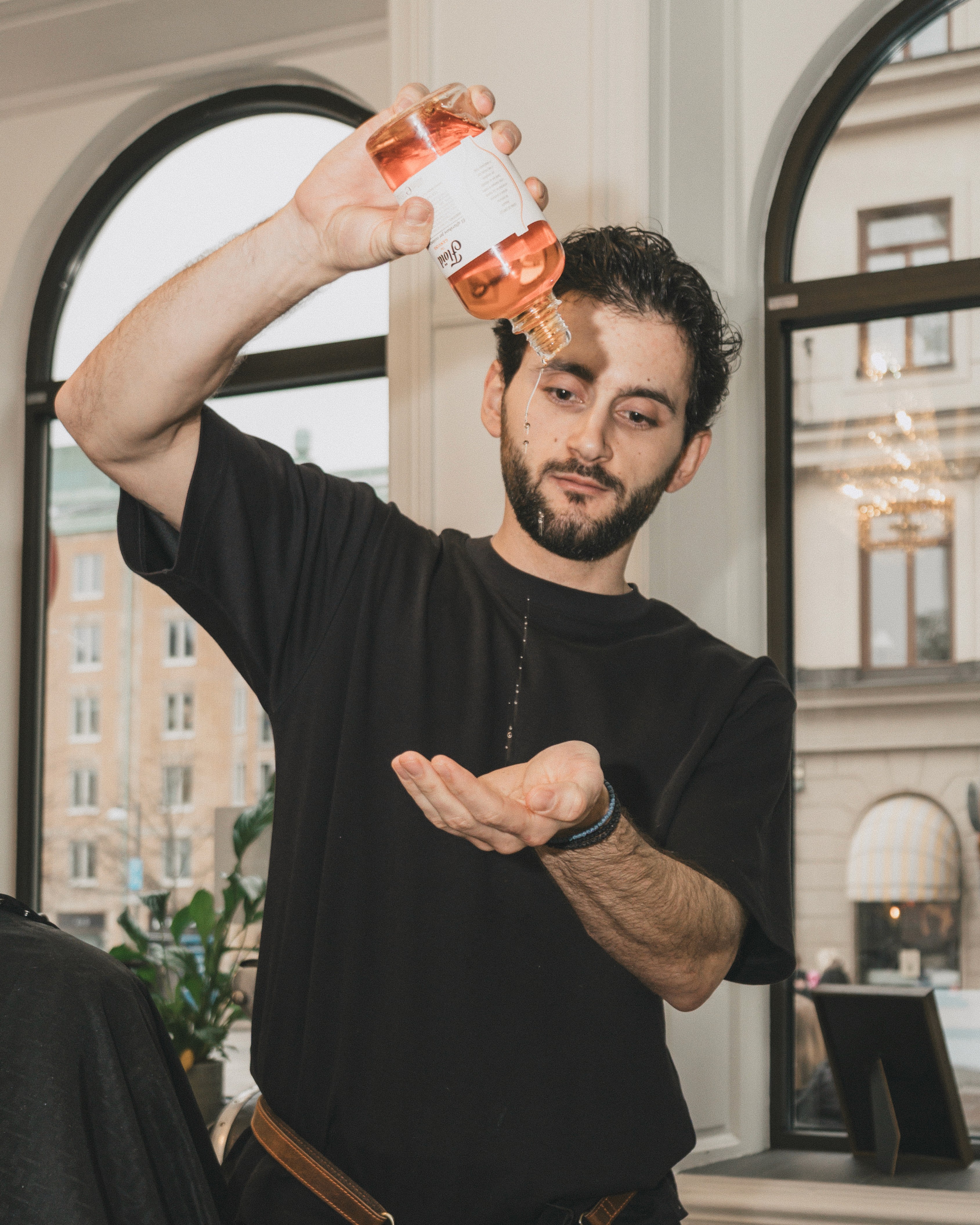 Man with beard getting hair blow-dried
