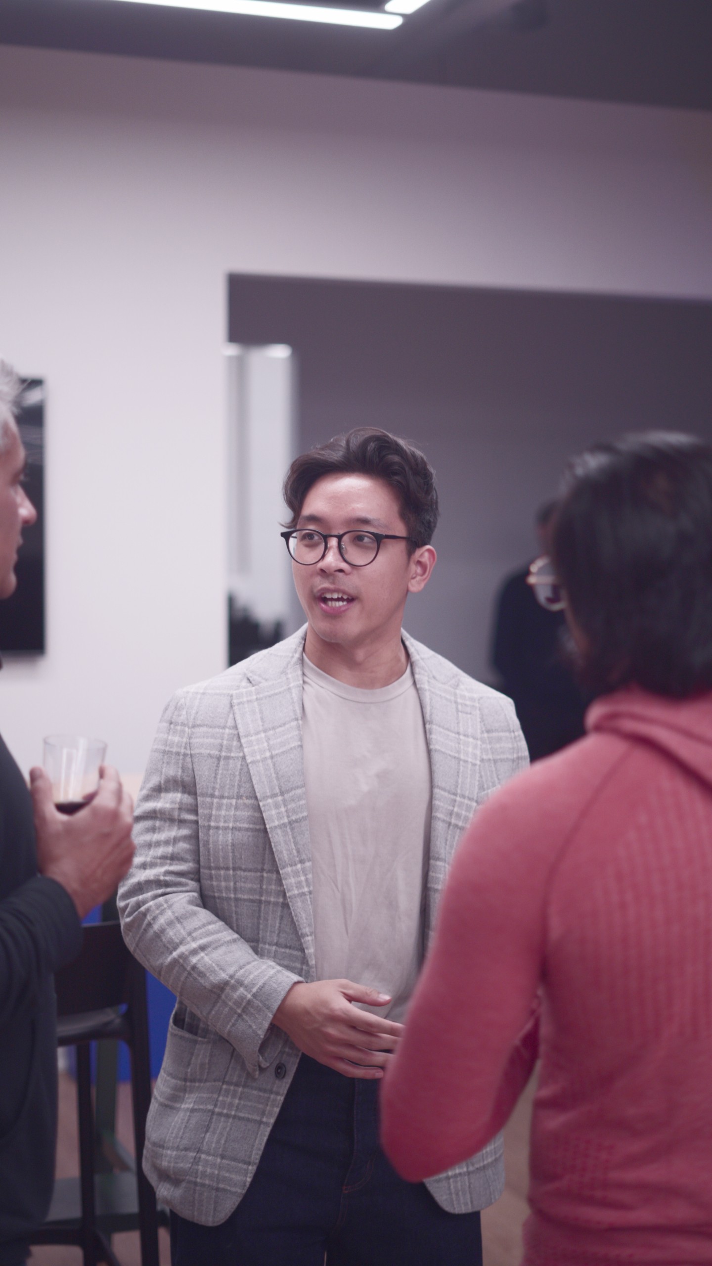 two women sitting at a table working on a laptop