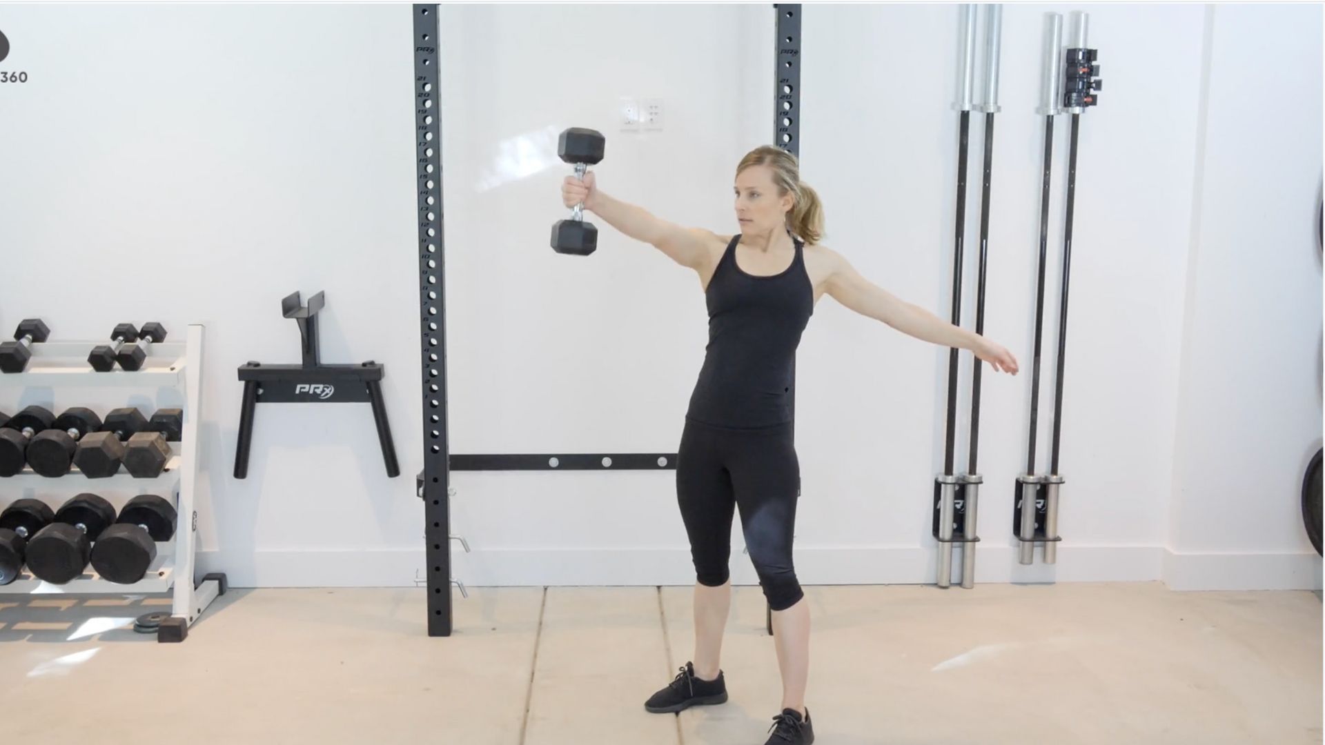 Susan Ohtake performing dumbbell swings