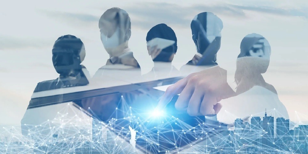 Conceptual double-exposure of a diverse team of professionals overlaid with a digital cityscape and a hand interacting with a glowing neural network on a tablet