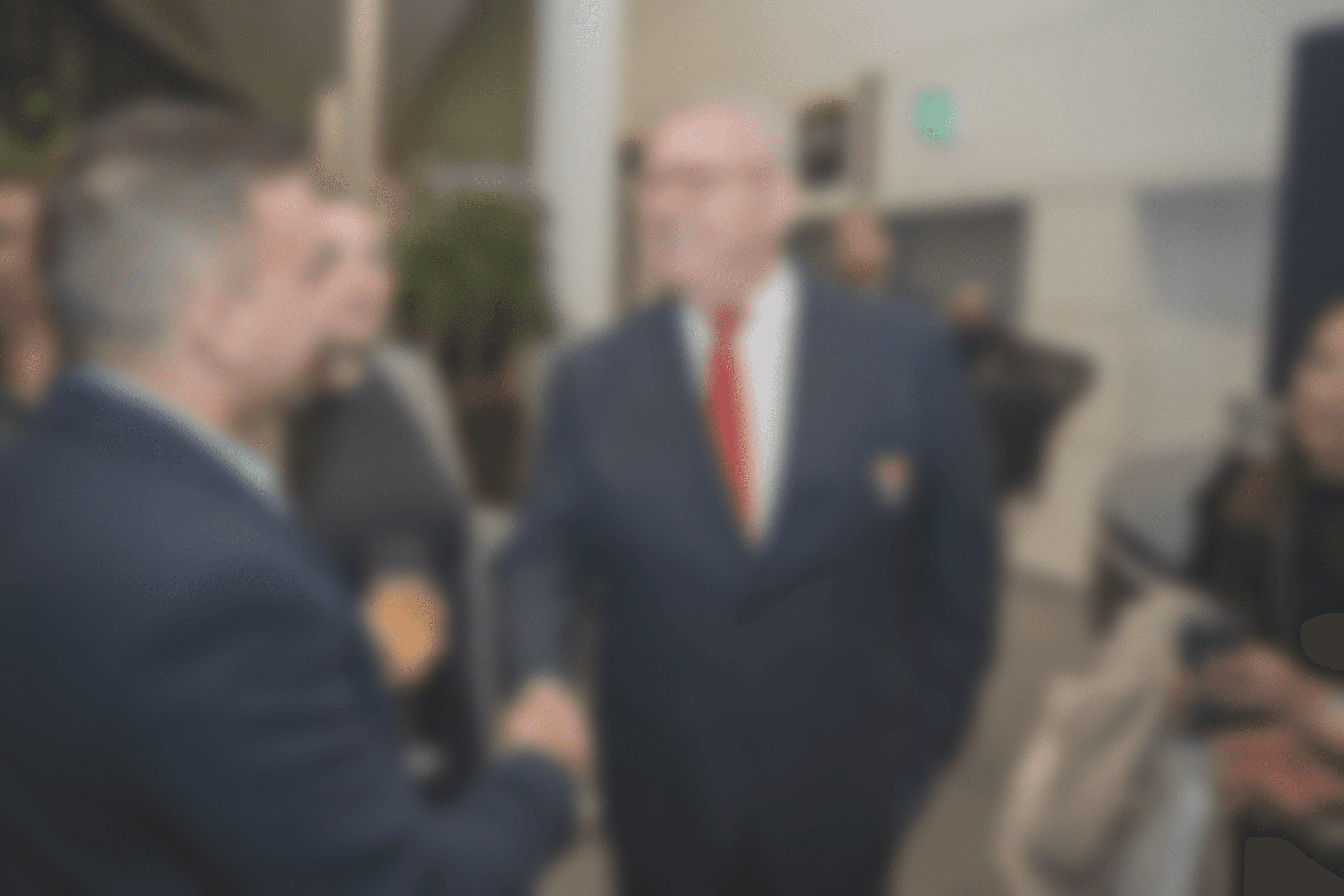 Modern spiral staircase with wooden accents and lighting