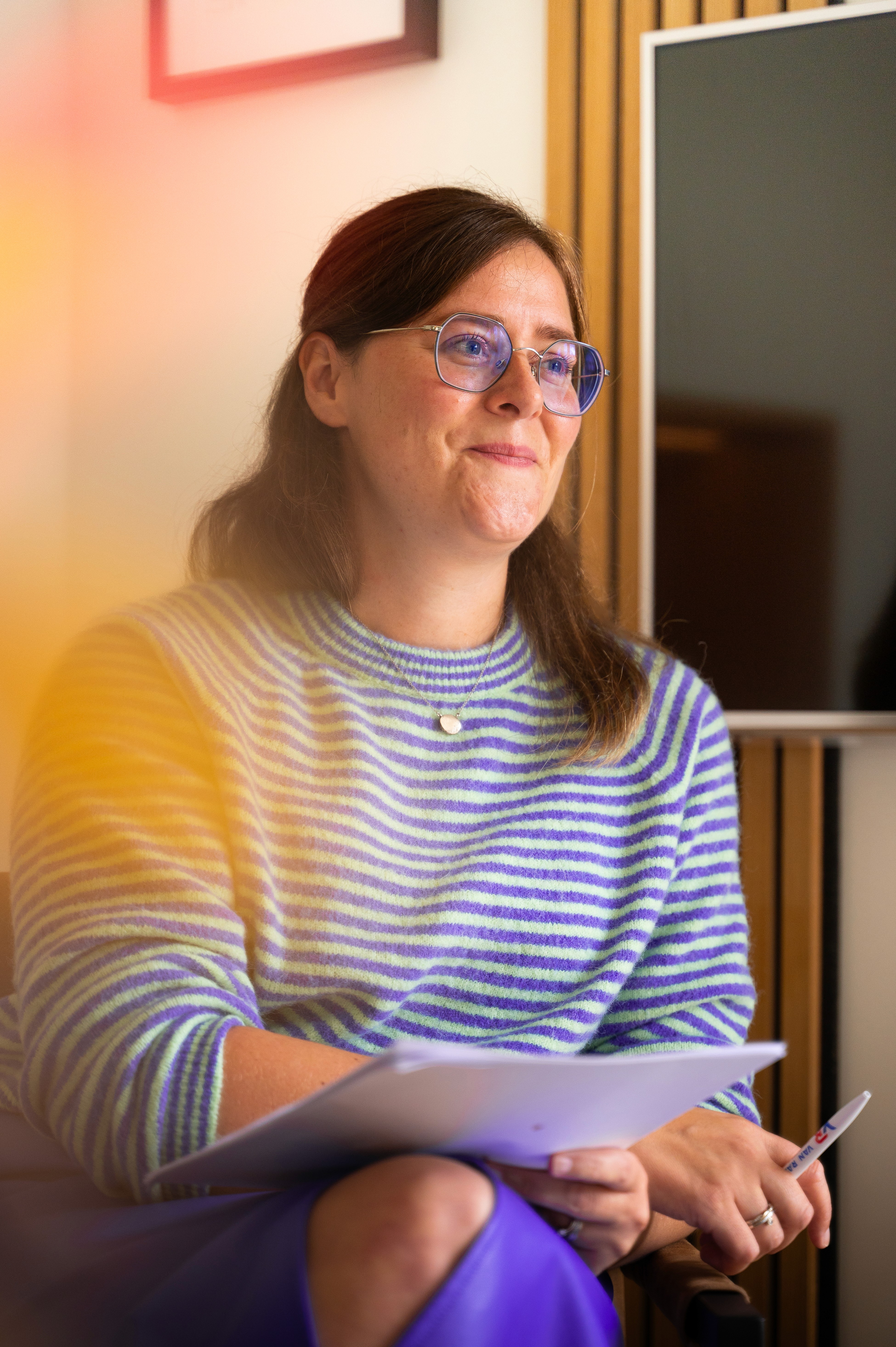 person sitting in a chair in front of a man