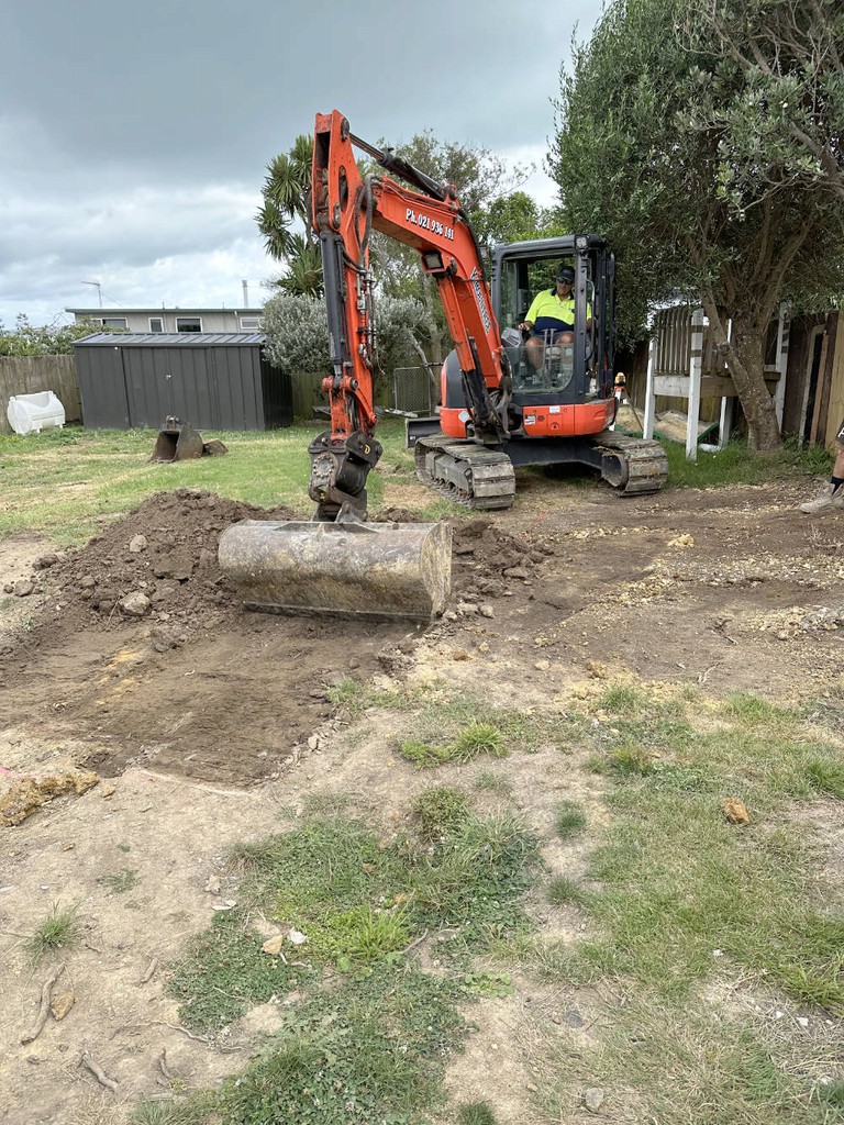 A digger beginning groundwork for a new project in East Auckland