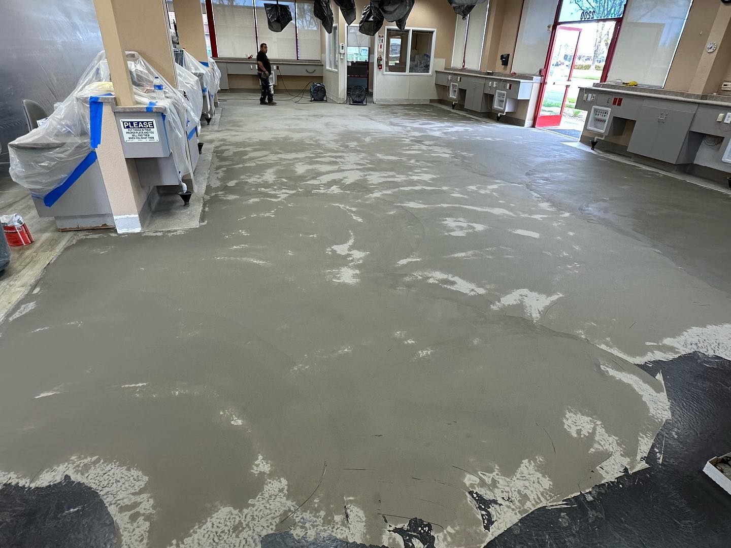 Self-levelling compound poured over a sealed concrete slab